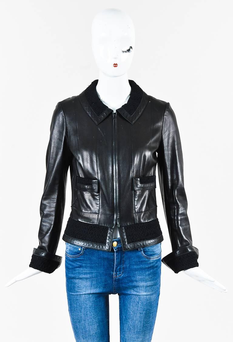 Size: 40 (FR)
Color: Black,
Made In: France
Fabric Content: Exterior: Lambskin; Inset: Silk; Lining: Silk

Item Specifics & Details: Features smocked silk panels, a zipped front, two front pockets, split cuffs, and 'CC' buttons at the sleeve