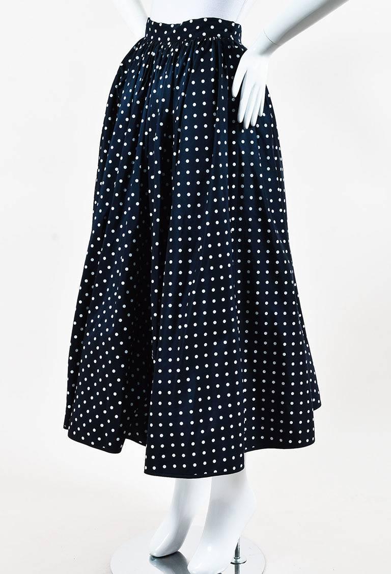 Size: 6
Color: Blue,White,
Made In: Italy
Fabric Content: Unknown
Item Specifics & Details: Features an allover polka dot print, a full body, tulle underlay, midi length, side pockets, and a side zip, hook-and-eye closure.
Measurements*:
Total