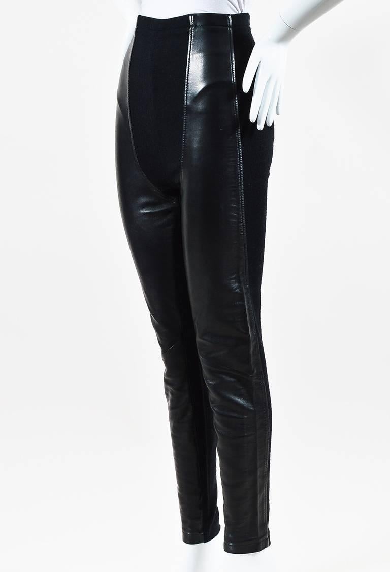 Size: Unknown
Color: Black,
Made In: Unknown
Fabric Content: Leather
Item Specifics & Details: Features a high-waist silhouette, tonal stitching, leather panels, skinny legs, and a center back zip closure.
Measurements*:
Total Length: 41