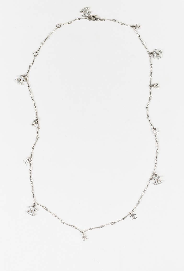 Silver-tone metal thin long chain link necklace from Chanel circa 2008. Small 'CC' charms. Slightly larger 'CC' charms feature crystal embellishments. Lobster clasp closure.

Made in: Unknown
Color: Silver
Content: Silver Tone Metal,