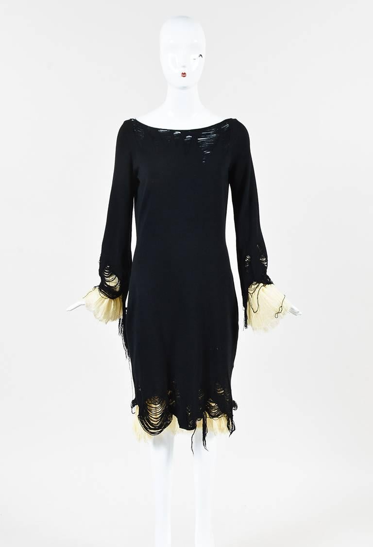 Sweater dress featuring a wool overlay with long sleeves and distressed detailing, a boat neck, and a contrasted underlay with frayed edges.

Size: Large
Color: Black,Cream,
Made in: Italy
Fabric Content: Exterior: Wool; Lining: Silk
Condition: