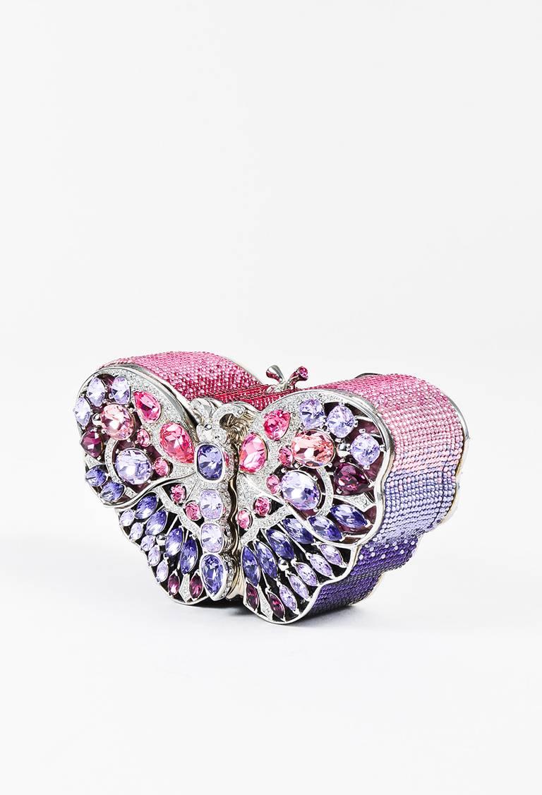 A limited edition Neiman Marcus 100th Anniversary exclusive, the "Celestrina" clutch is a stunning piece featuring multicolored faceted stones in a butterfly pattern. Austrian crystal encrusted. Top kiss lock closure. Luxe alligator skin