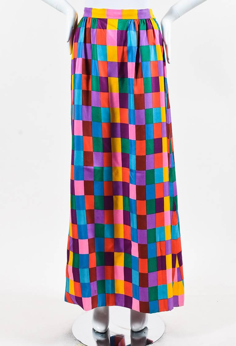 Vintage Nan Duskin skirt featuring an allover multicolored print, maxi length, and a side zip closure. Lined.

Size: Unknown
Color: Blue,Green,Multicolor,Orange,Pink,Purple,Red,Yellow,
Made in: Italy
Fabric Content: Silk
Condition: Pre-owned.