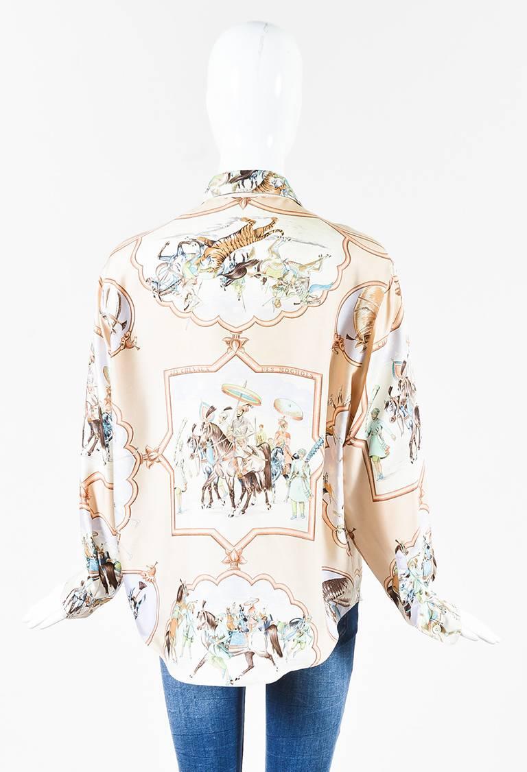Light pink and multicolor silk long sleeve collared button up blouse from Hermes features the print entitled 