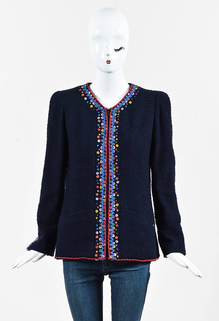 Whimsical vintage Chanel jacket from the fall 1997 collection. Wool construction with boucle knitting. Multicolored dot trimmings. Collarless. Long sleeves. Side flat pockets. Padded shoulders. Front zip closure. Lined.

Size: 40 (FR)
Color: