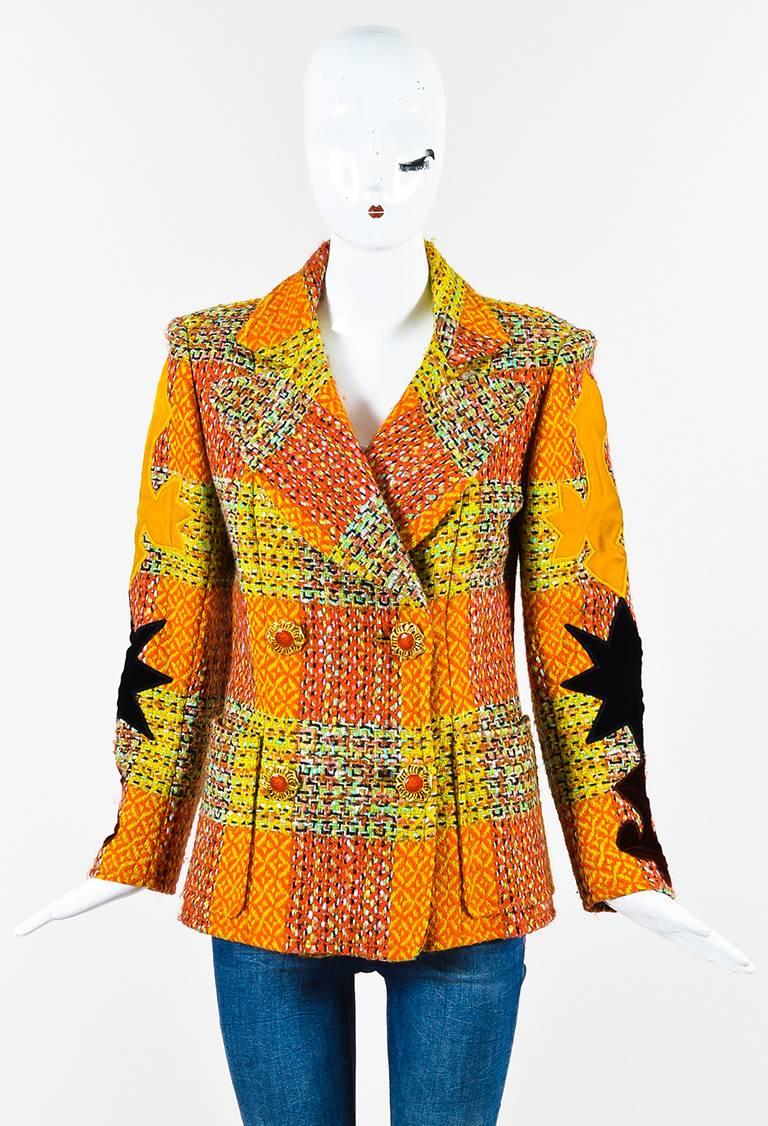 Tweed textile construction. Multicolored woven patchwork pattern. Long sleeves with velvet patches. Notch lapels. Side patch pockets. Padded shoulders. Embellished double-breasted button closure. Lined.

Size: 40 (FR)
Color:
