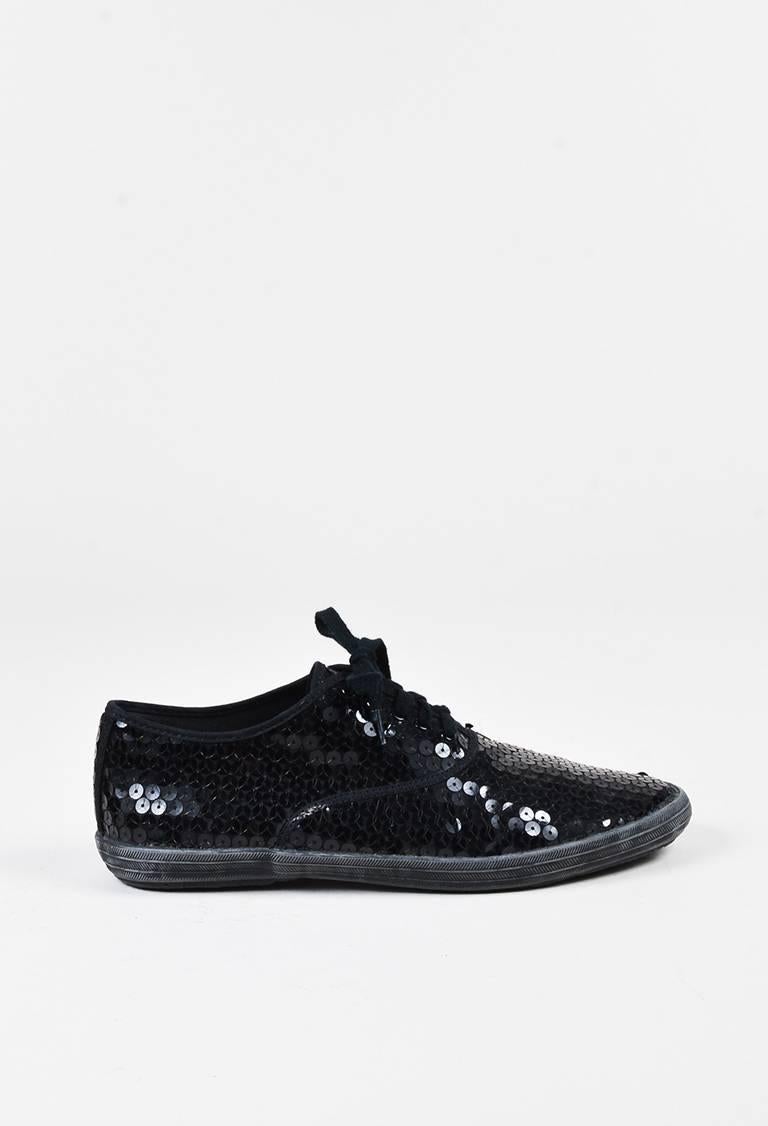 Features an allover sequin embellishment, a lace-up front, and a textured platform.

Size: 24.5
Color: Black,
Made in: Japan
Fabric Content: Upper: Textile; Insole: Synthetic; Outsole: Synthetic
Condition: Pre-owned. Residue at platforms and