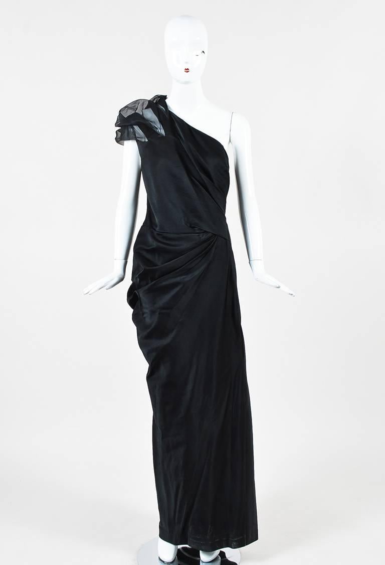 Black silk satin gathered one shoulder gown from J. Mendel. Sheer chiffon gathered cap sleeve. Back invisible zipper and hook and eye for closure. Lined.

Size: 14 (US)
Color: Black,
Made in: USA
Fabric Content: Silk
Condition: Pre-owned. Slight