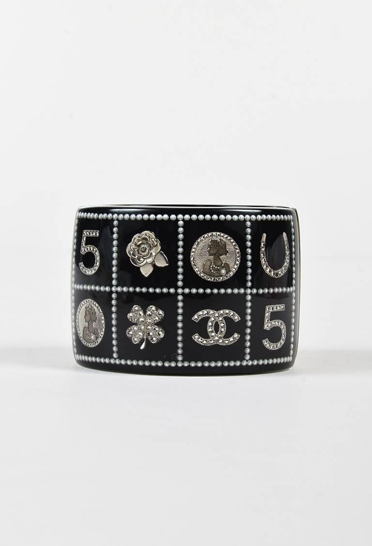 Bold bangle from Chanel's cruise 2014 collection to make a statement to any look. Silver-tone hardware. Resin construction. Clear exterior with quilted feminine faux pearls and the brand's signature logos on interior. Magnetic closure.

Color: