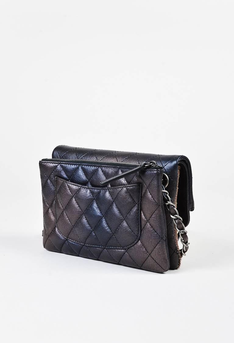Luxurious purple and chocolate colored Chanel flap bag from the fall 2015 collection. Supple leather construction with an ombre iridescent sheen. Shimmering metallic pony hair panel. Diamond quilted stitching. Oxidized silver-tone hardware. Leather