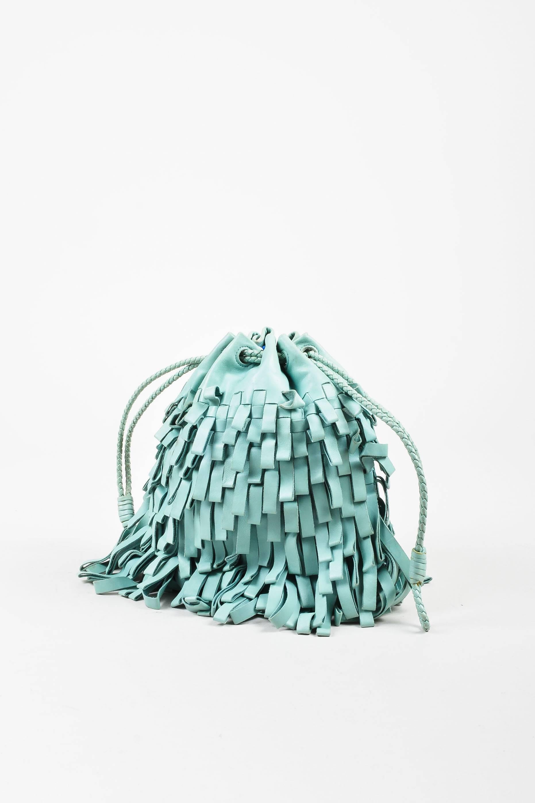 Bottega Veneta mint green leather fringe bag, featuring a braided drawstring top closure. Limited Edition. Comes with dust bag. Lined. Model/serial #: 115674-V1801-4900.