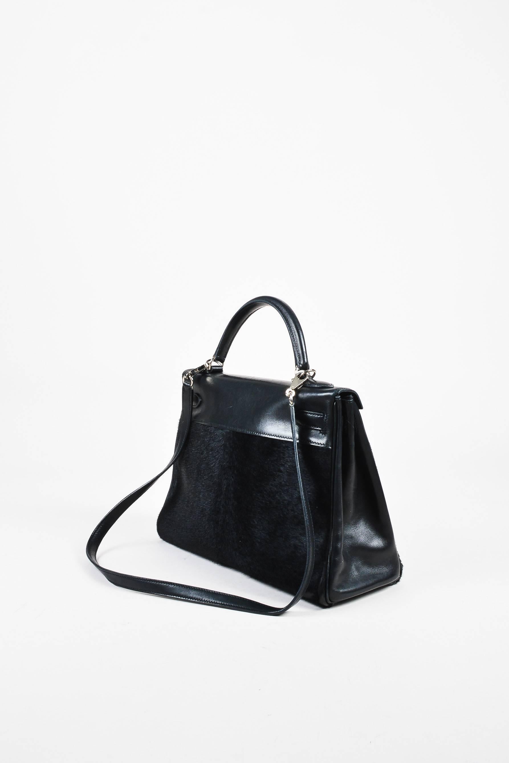 One of the single most iconic pieces in fashion's history--this classic Retourne style "Troika Kelly" bag, from French house Hermes, is a handcrafted collectible. Masterfully constructed of ponyhair, evercalf, and box calf leathers in a
