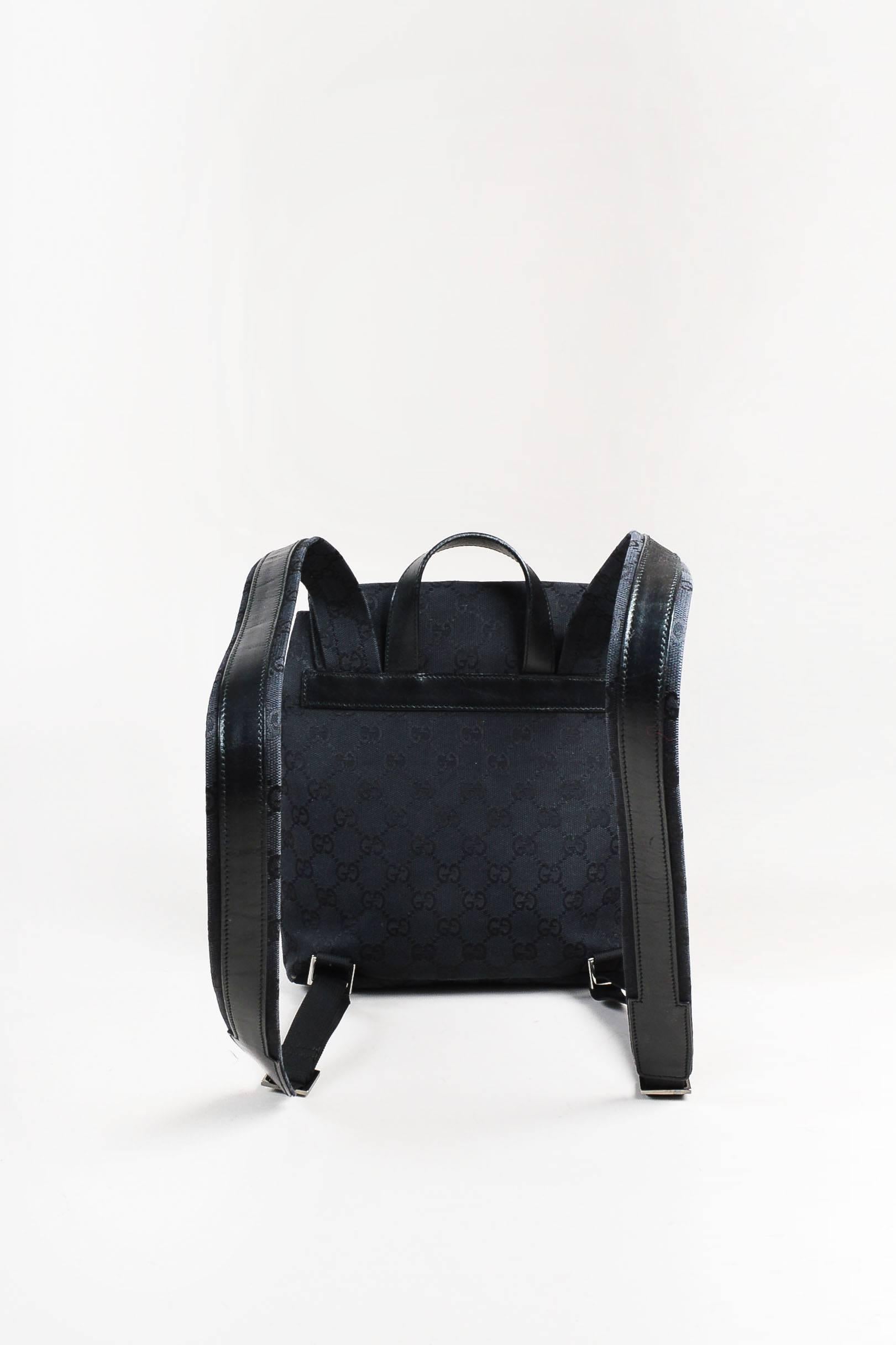 black canvas mini backpack