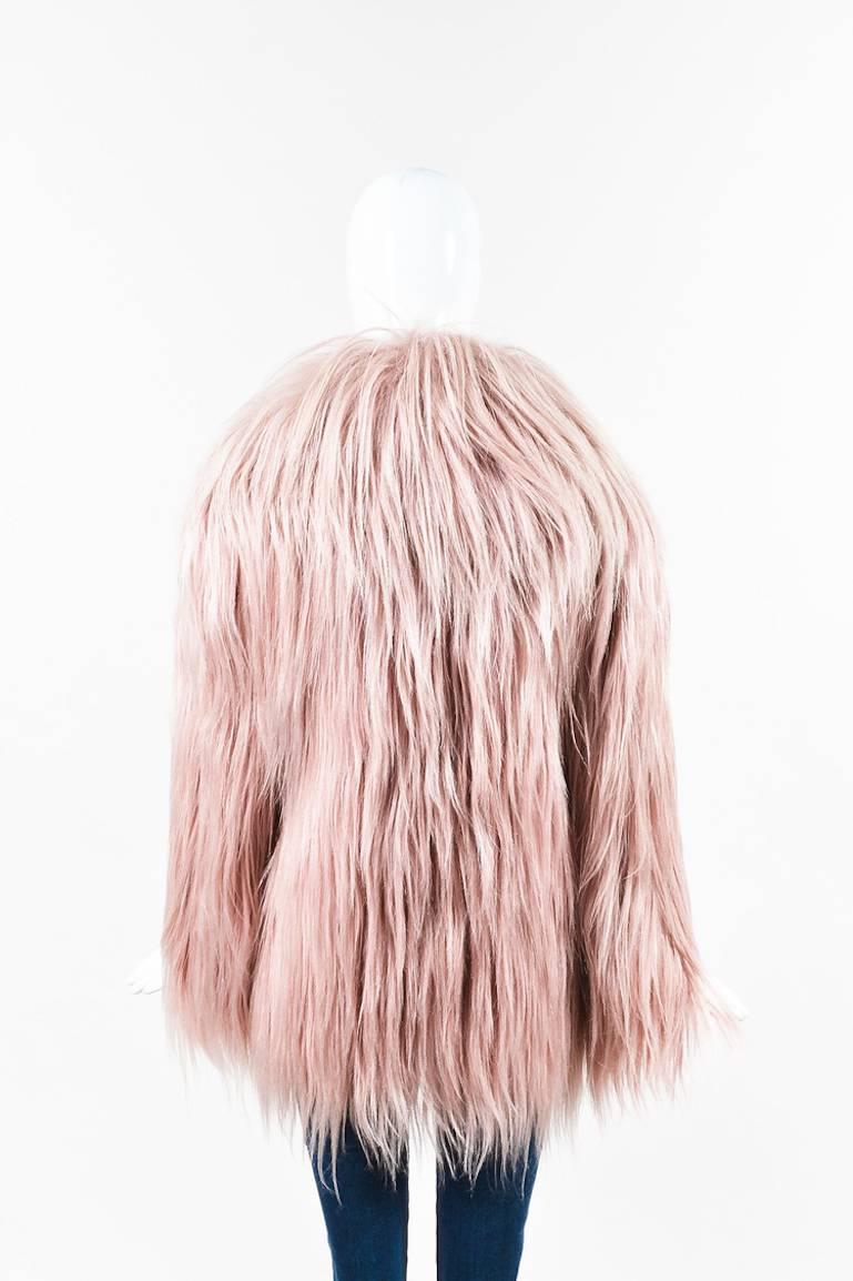 Retails at $8000. From the Gucci AW 2014 Runway collection, this is an amazing and rare find. Constructed of candy-pink thick, sleek genuine goat hair coat. Featured in countless editorials, some featuring the likes of Kendall Jenner, Salma Hayek, 