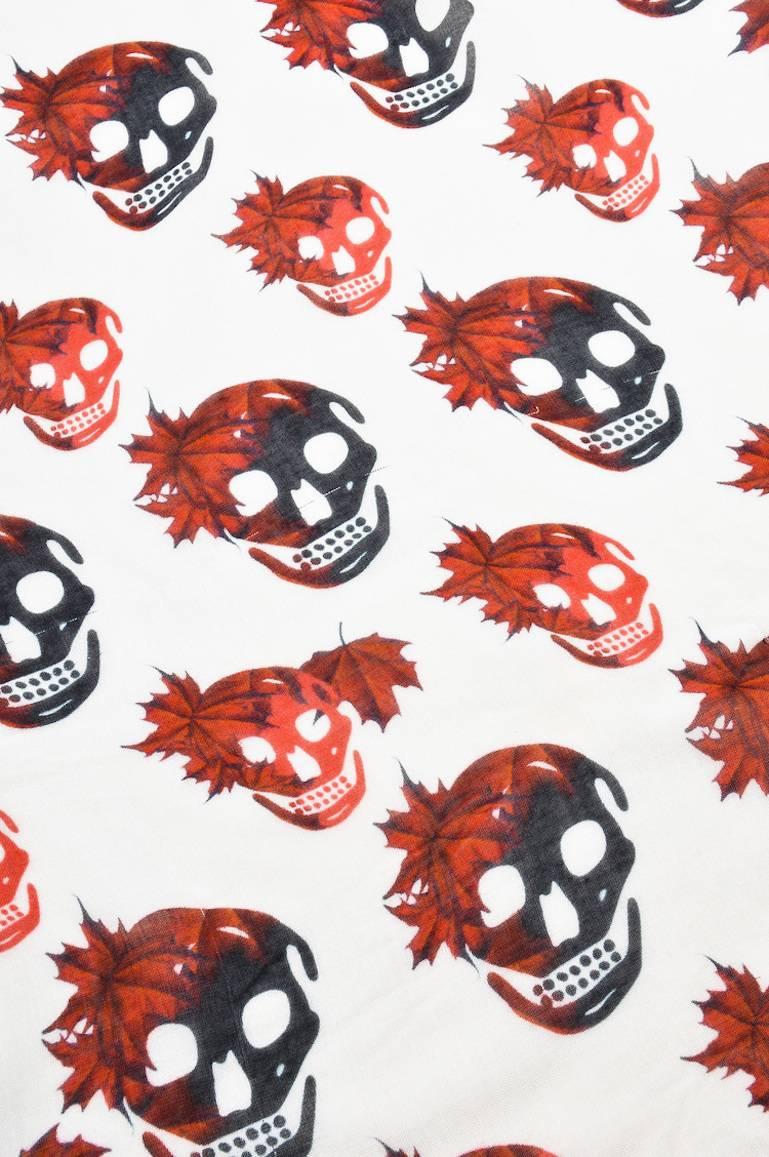 This limited edition scarf for the 2010 Toronto Olympics is the perfect accessory to add edge to your look. Constructed of a soft modal-cashmere blend. Features a red and black maple leaf and McQueen's signature skull print. Red fringe trim.