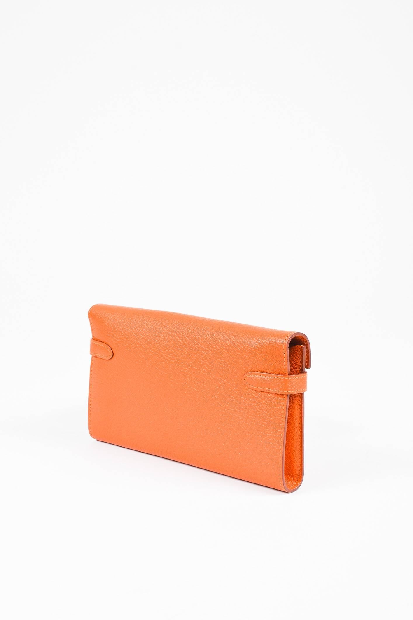 Color: Orange,Feu
Style: Kelly
Made In: France
Fabric Content: Chevre Mysore Leather

Item Specifics & Details: A must-have everyday accessory that also doubles as an evening clutch, the iconic "Kelly" wallet in a beautiful shade