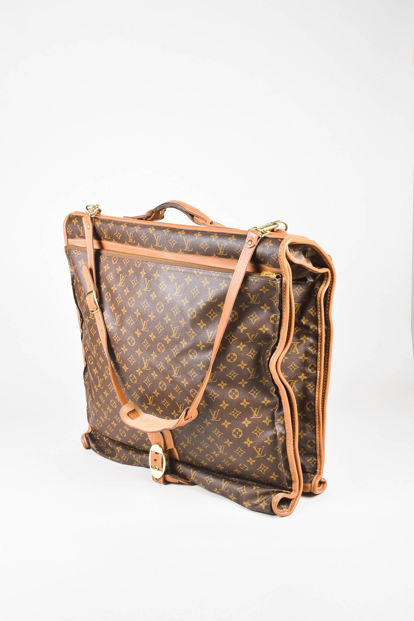 Fabric Content: Coated Canvas, Leather, Metal

Item Specifics & Details: VINTAGE Louis Vuitton and The French Luggage Company. A vintage piece of iconography, this luxurious garment bag from the 1970s/1980s is constructed of signature coated