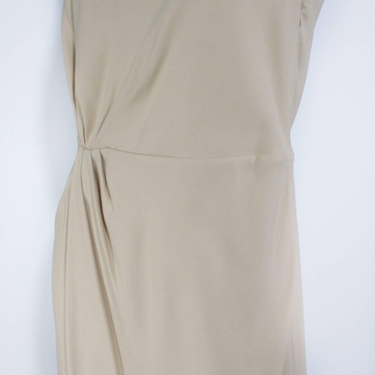 Valentino nude dress
Sleeveless
New with tags 
Originally $1790.00
Size 8