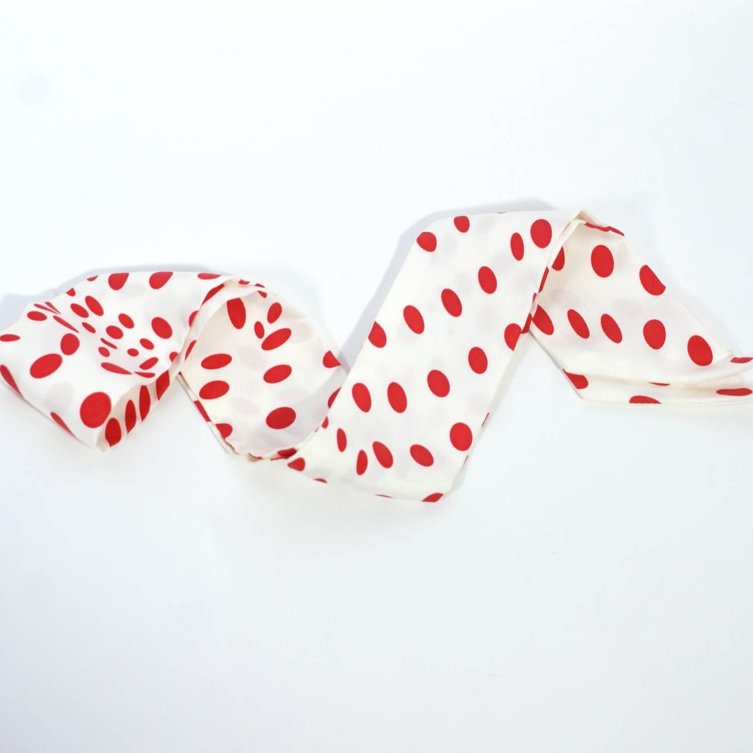 white scarf with red polka dots