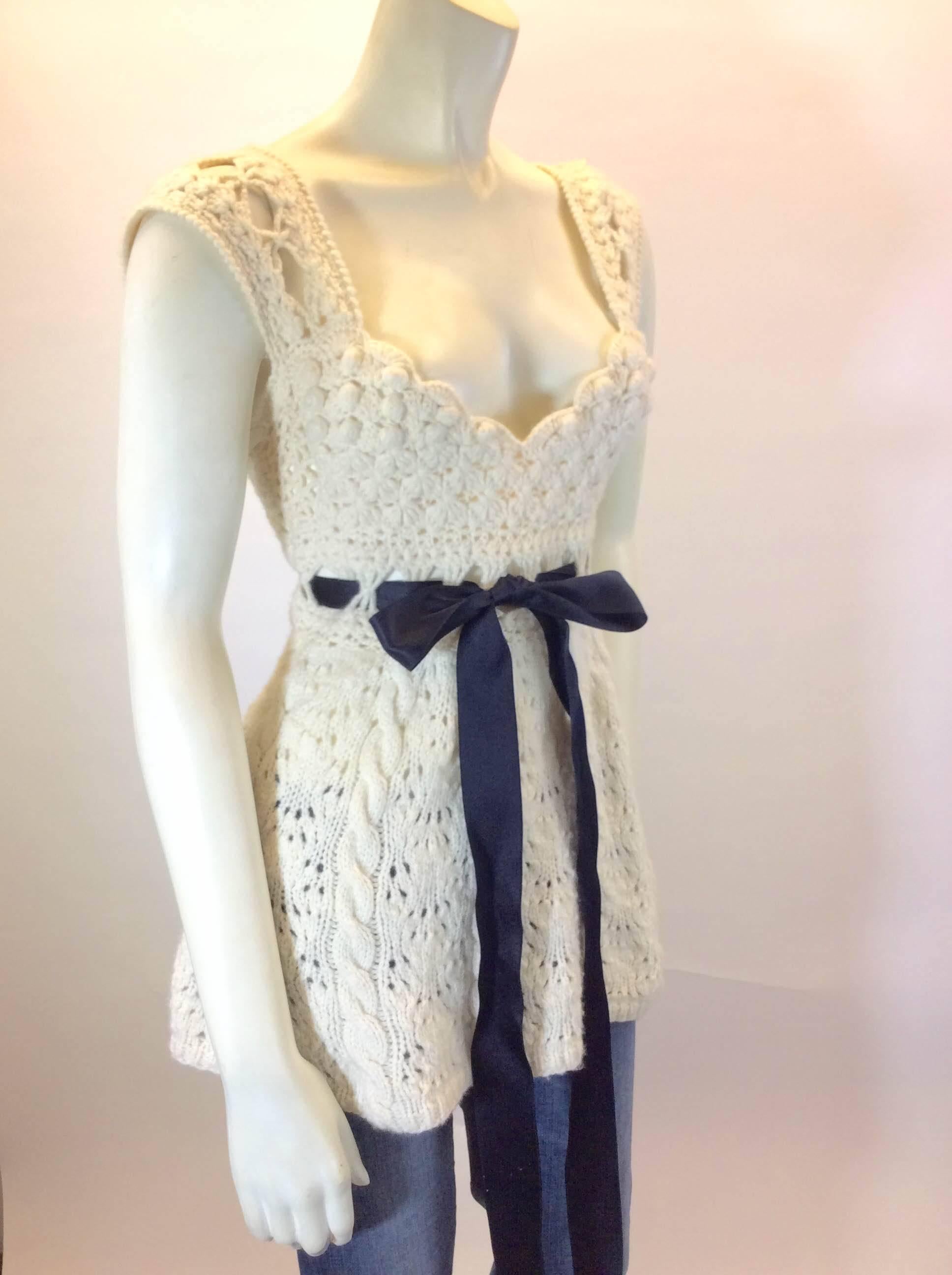 Ivory Cable Knit/Open Embroidery 
100% Cashmere
Black Velvet Ribbon Belt
Intricate Knitting on Bust and Back
97