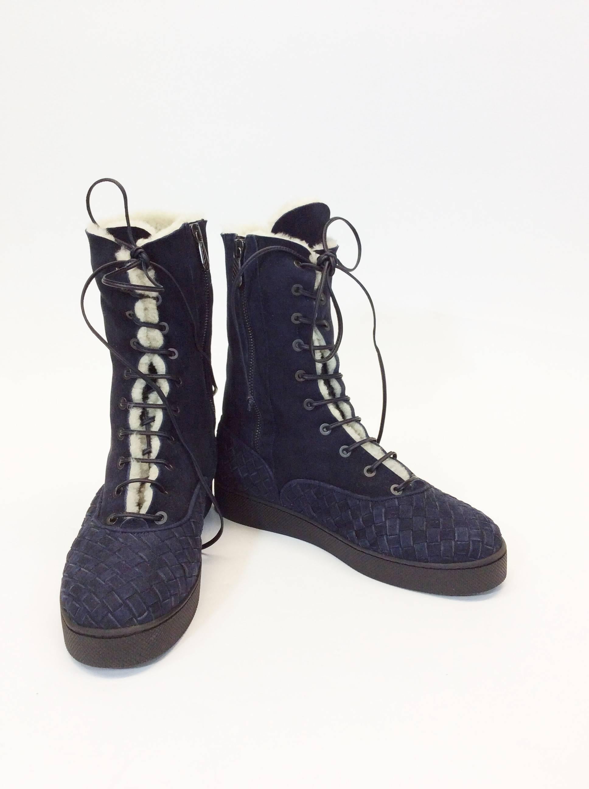 Sheep Skin Interior for Warmth
Navy Blue Suede 
Woven design around Ankle and Toe
Lace up Front and Side Zipper
3.5" Inch Sole 1" Inch Platform
UK Size 38 Equates to US 7.5