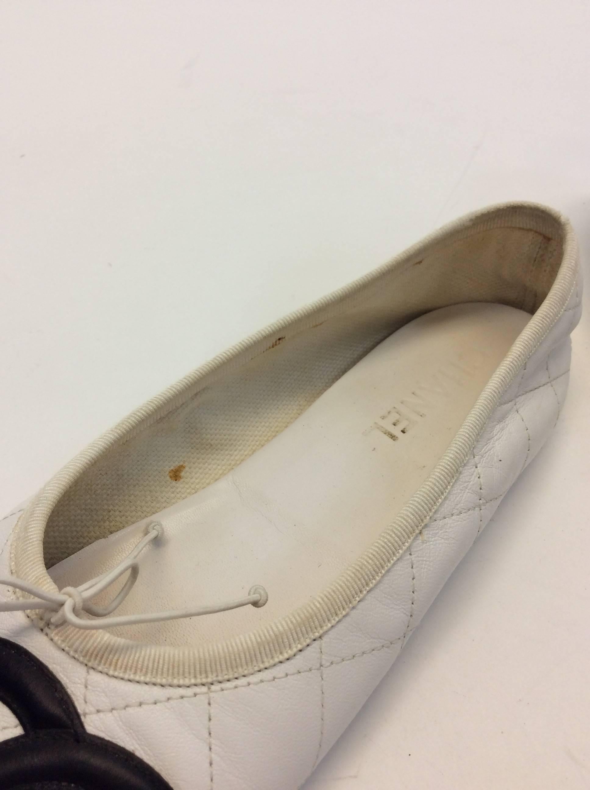 Women's Chanel White and Black Pleated Cambon Leather Ballet Flat