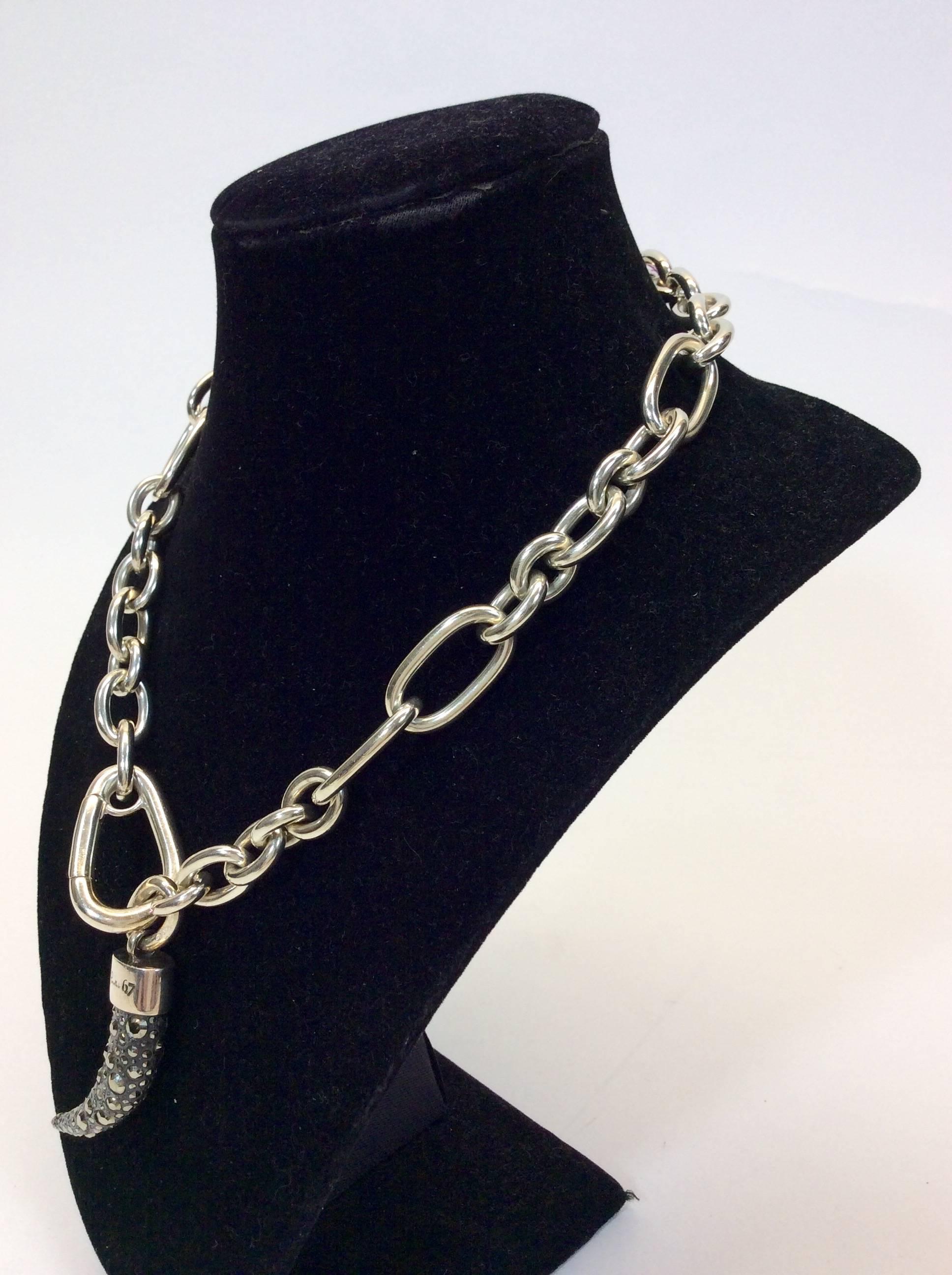 Retailed at $3,190.00 
Sterling Silver
Adjustable Chain Necklace with an Oversized Clasp 
Horn Charm Embellished with Marcasite 
Raw material used: Pyrite
Length Approximately 45 CM