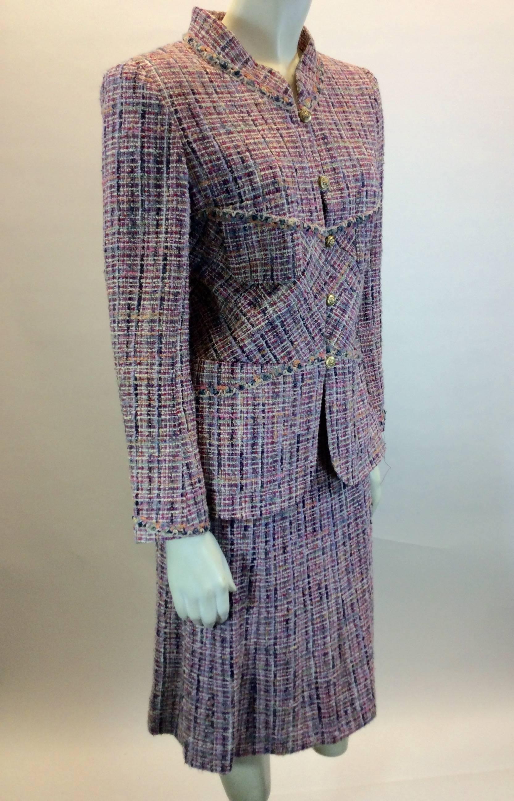 Chanel Classic Tweed Skirt Suit Set 
Goldtone Buttons up front of jacket for closure 
Pockets on both sides of Jacket
Hidden Zipper on Back of skirt for Closure 
Original Price; $2,250.00
