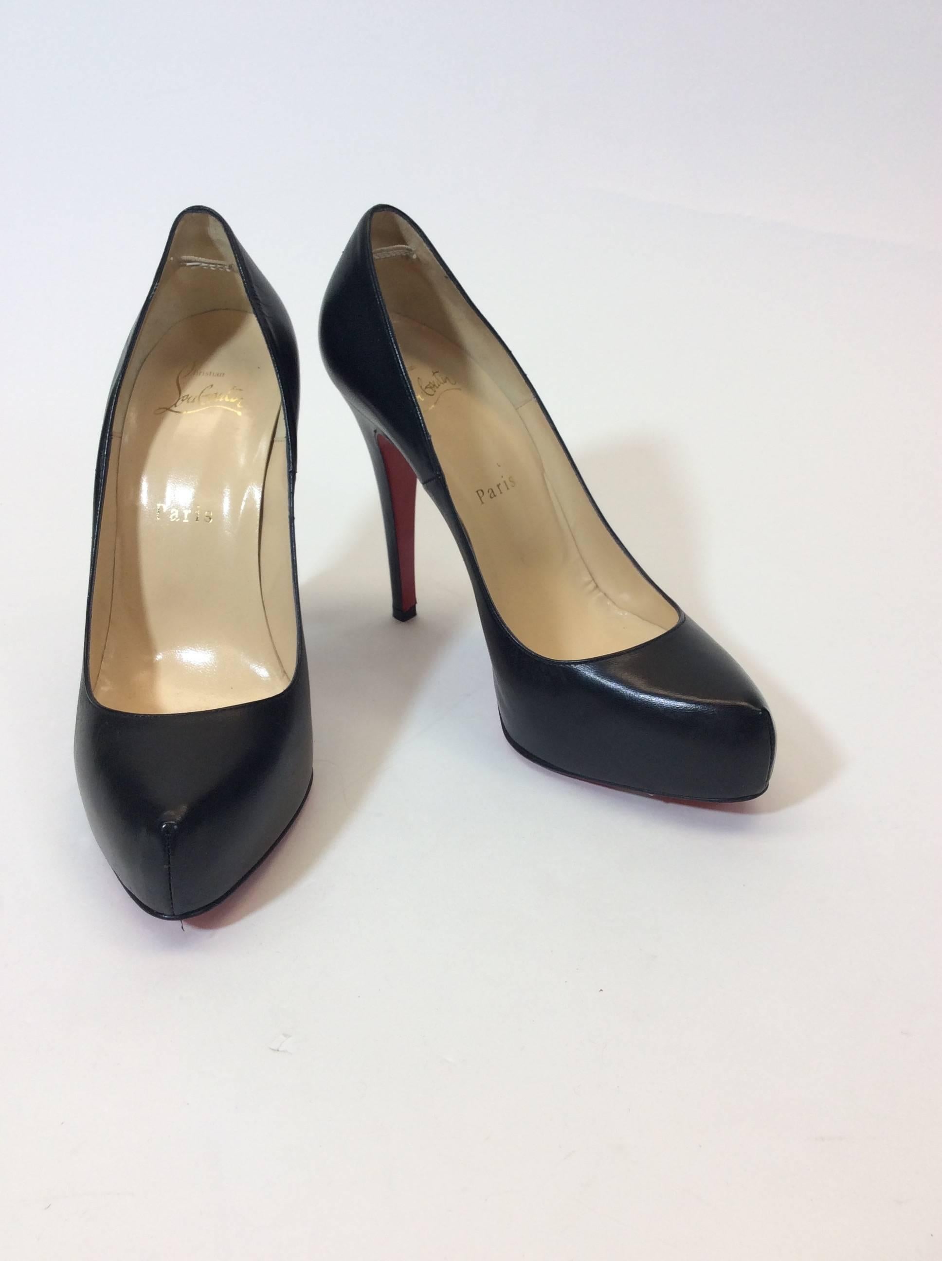 Black Leather Pump
Iconic Red Sole with Minimal Wear
3
