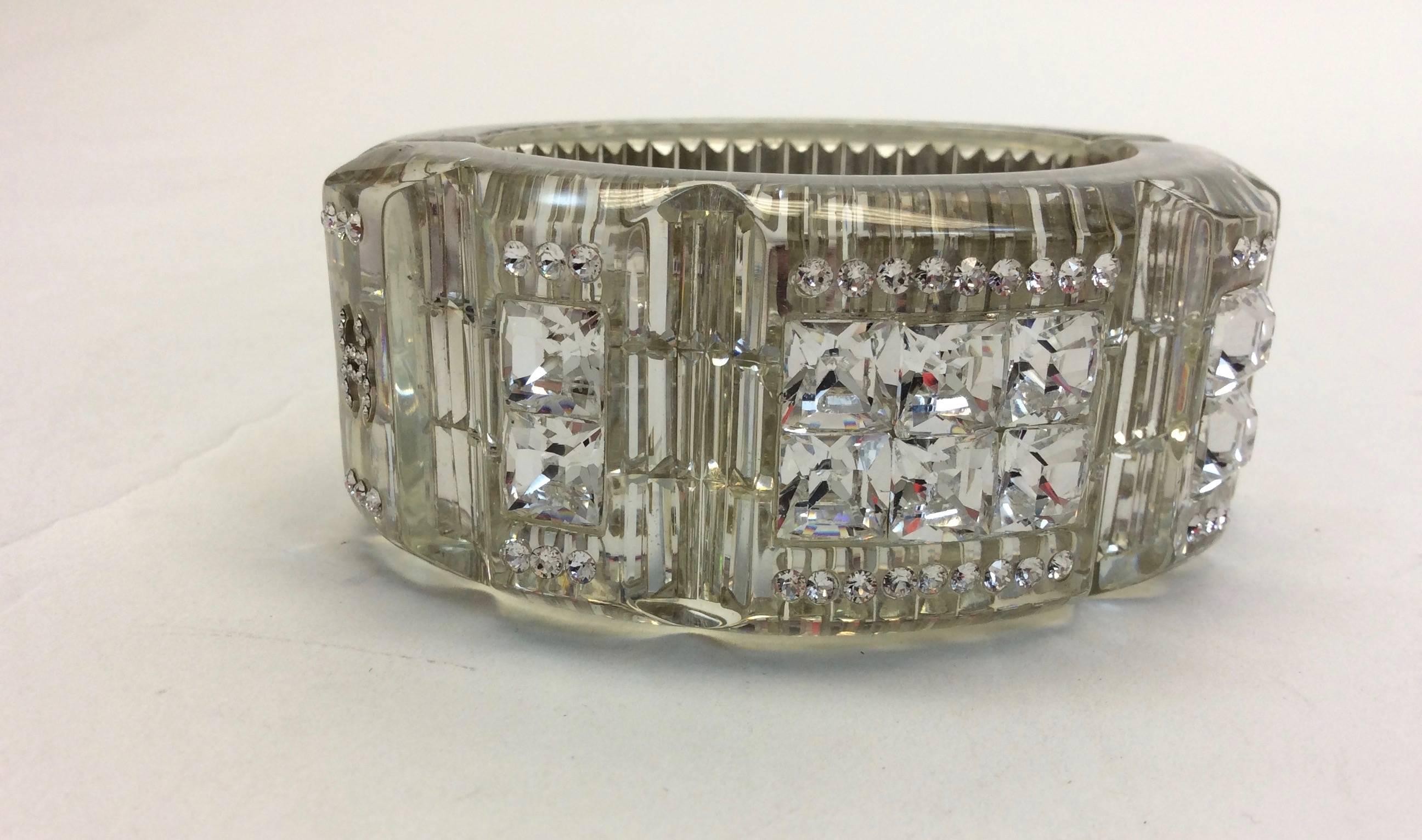 CC Logo on Sides 
Snap Shut for Closure
Intricate Crystal details
Transparent Design Bangle
Includes Box
Original Price: $2500.00