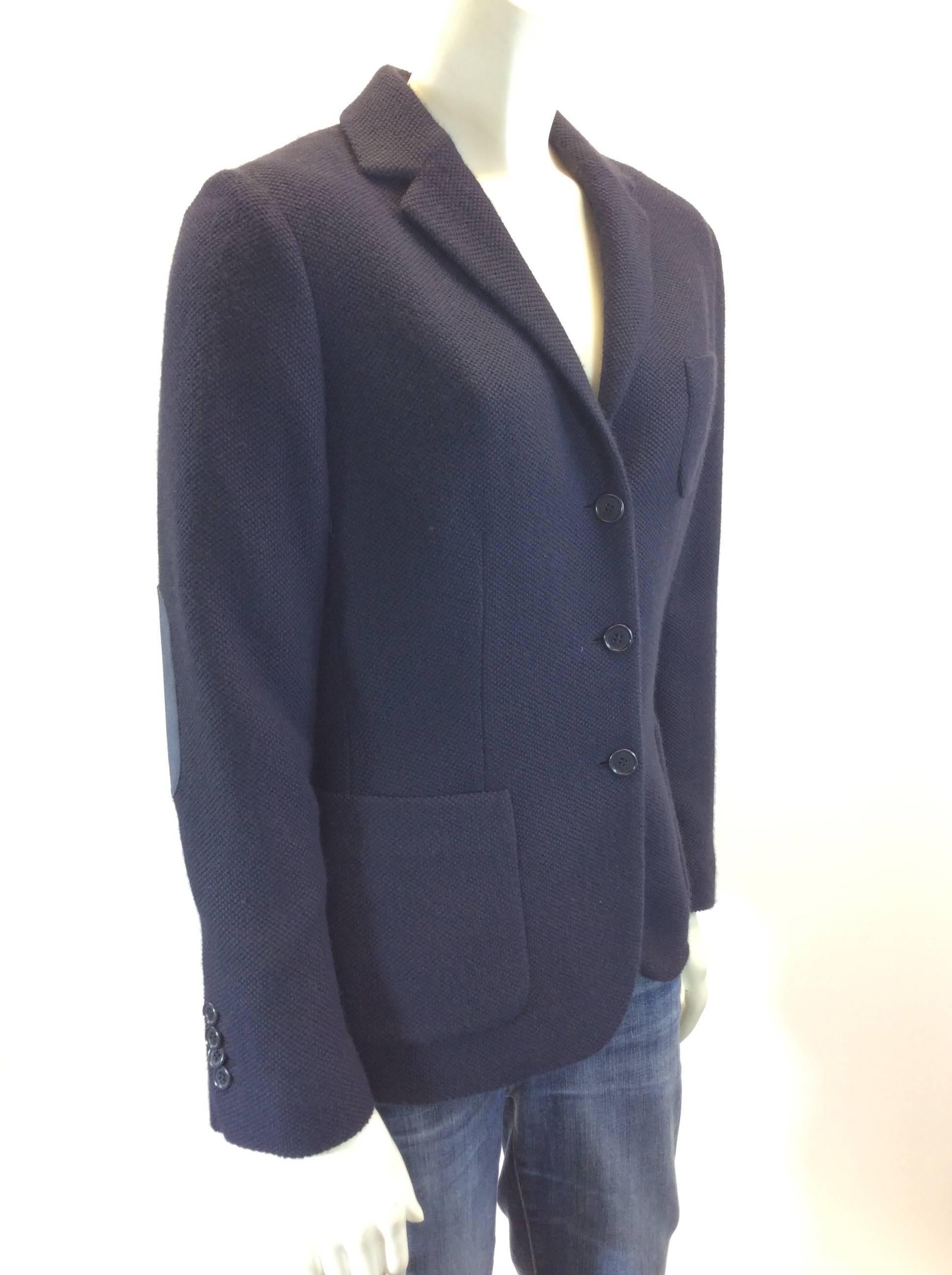 100% Navy Cashmere
Three Buttons on front for Closure
Navy Blue Suede Eblow Patches
One Pocket on Left Breast
Single Pocket on either Side
23" Inch Sleeve