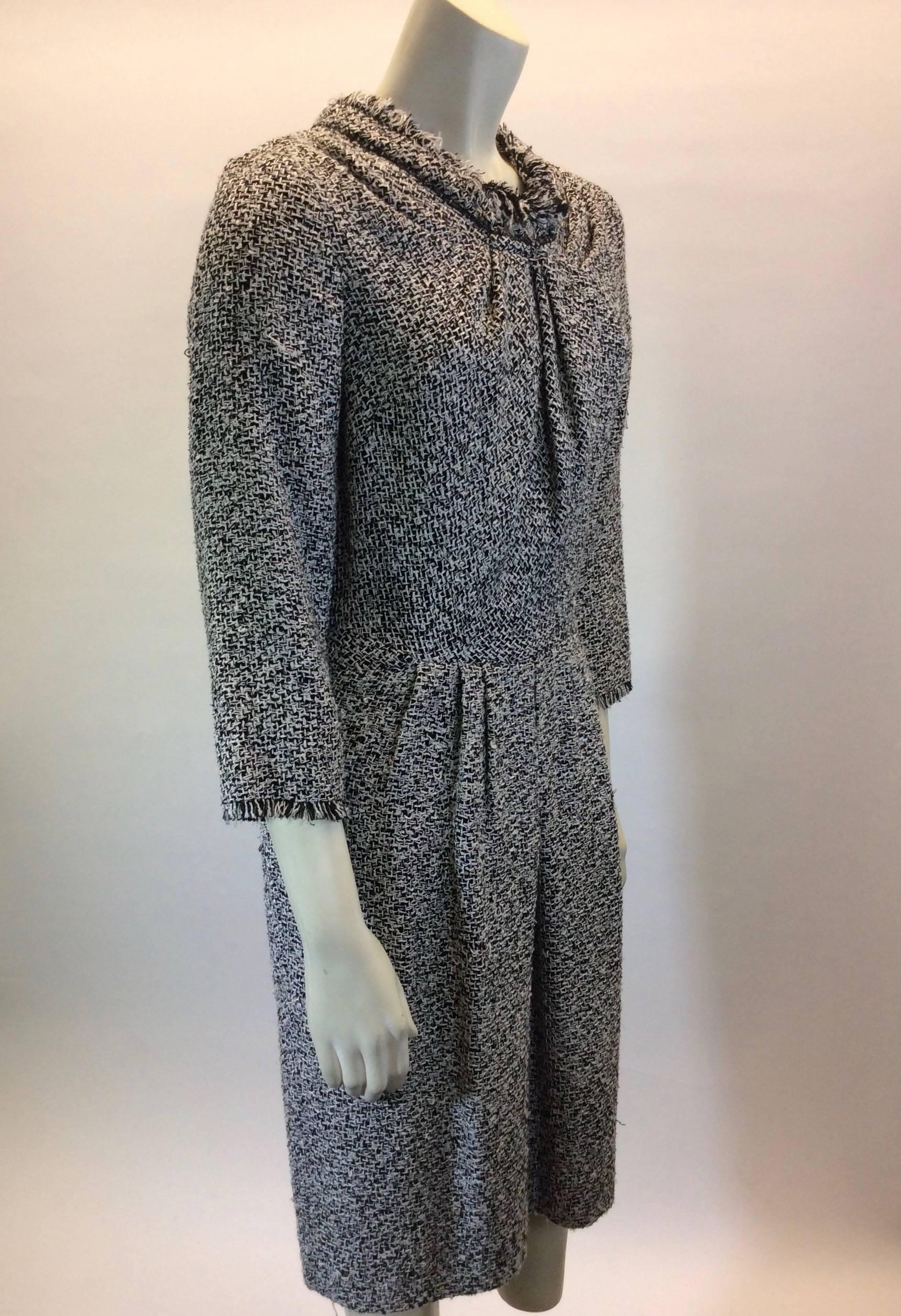 Black and White Tweed
Roucheing at Neckline
Frayed Edges
19" Inch Sleeves
Hidden Zipper up back for Closure
USA Size 6