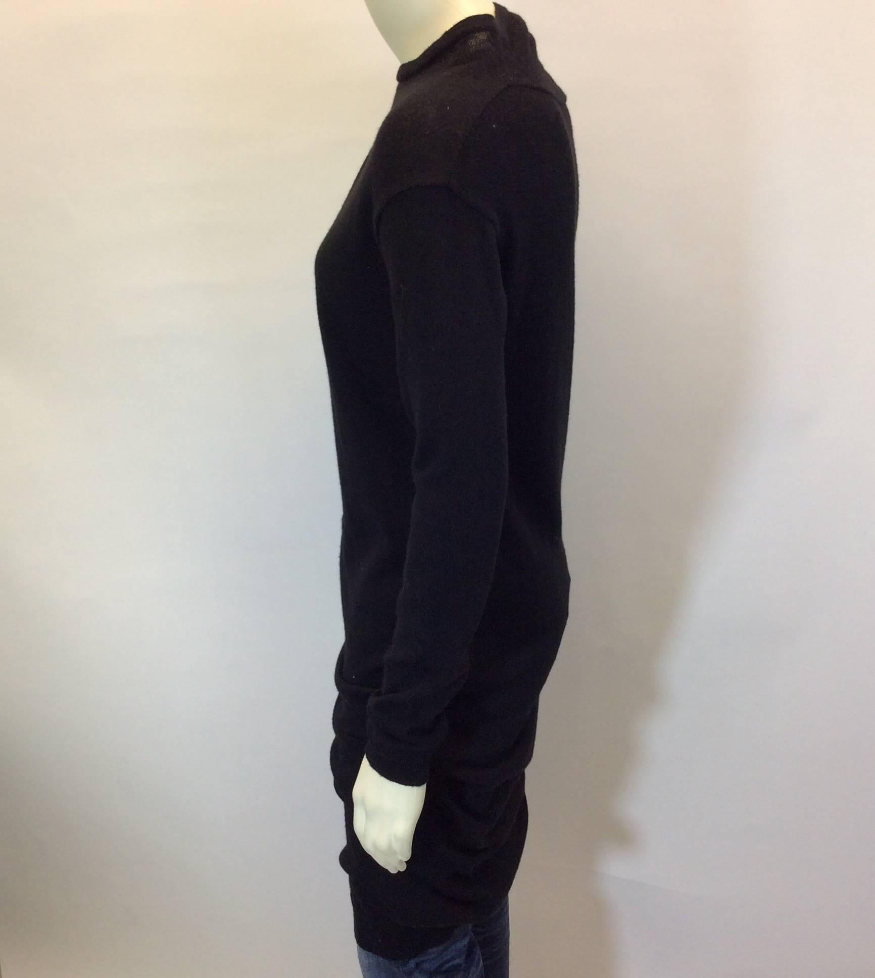 Black Rouched Sweater Dress
Rouching on right shoulder
Ribbed cuff and hem
Size Small
50% Polyester, 40% Alpaca, 10% Fleece Wool
