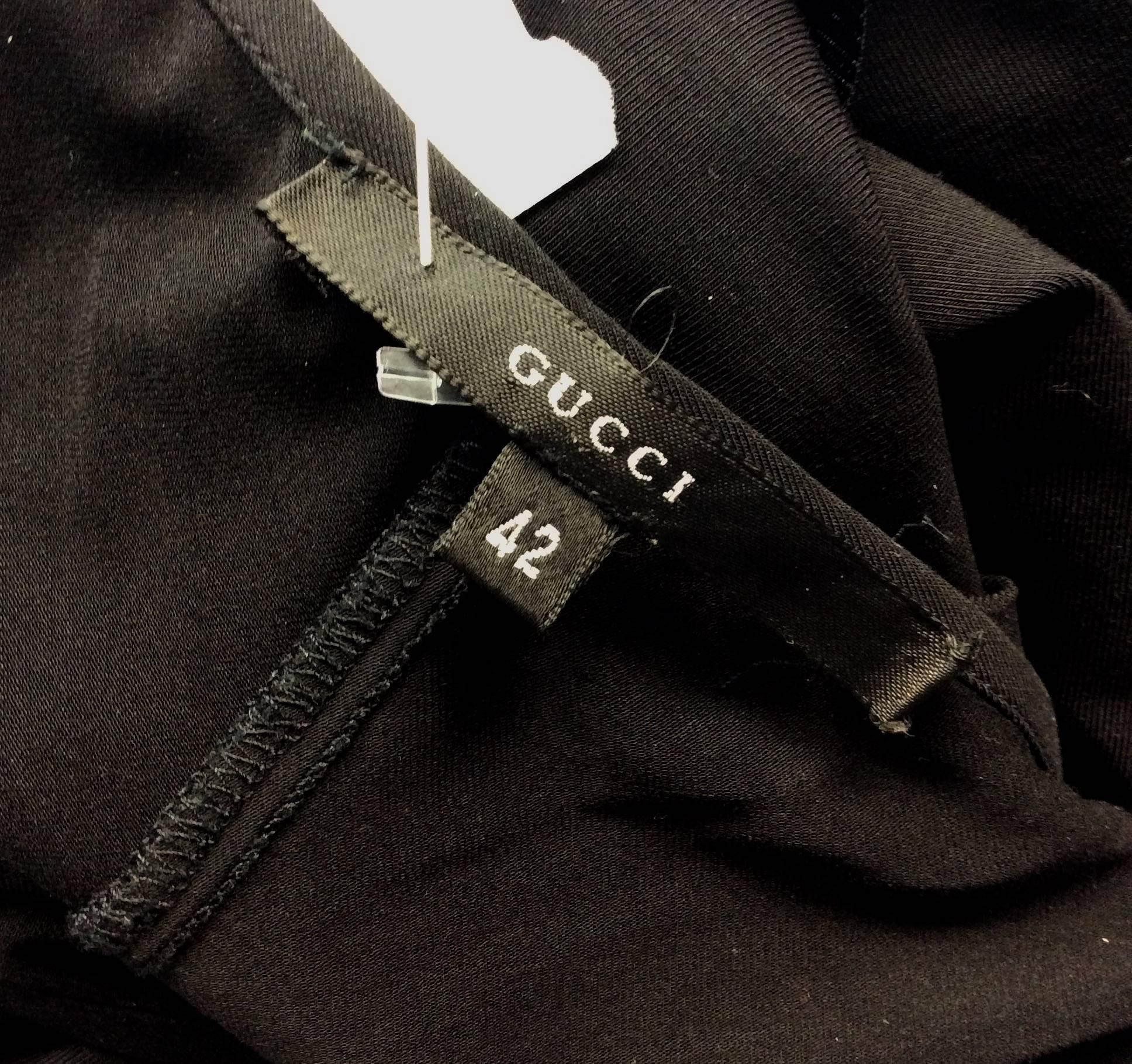 Gucci size 42 dress with lace trim and spaghetti strap
