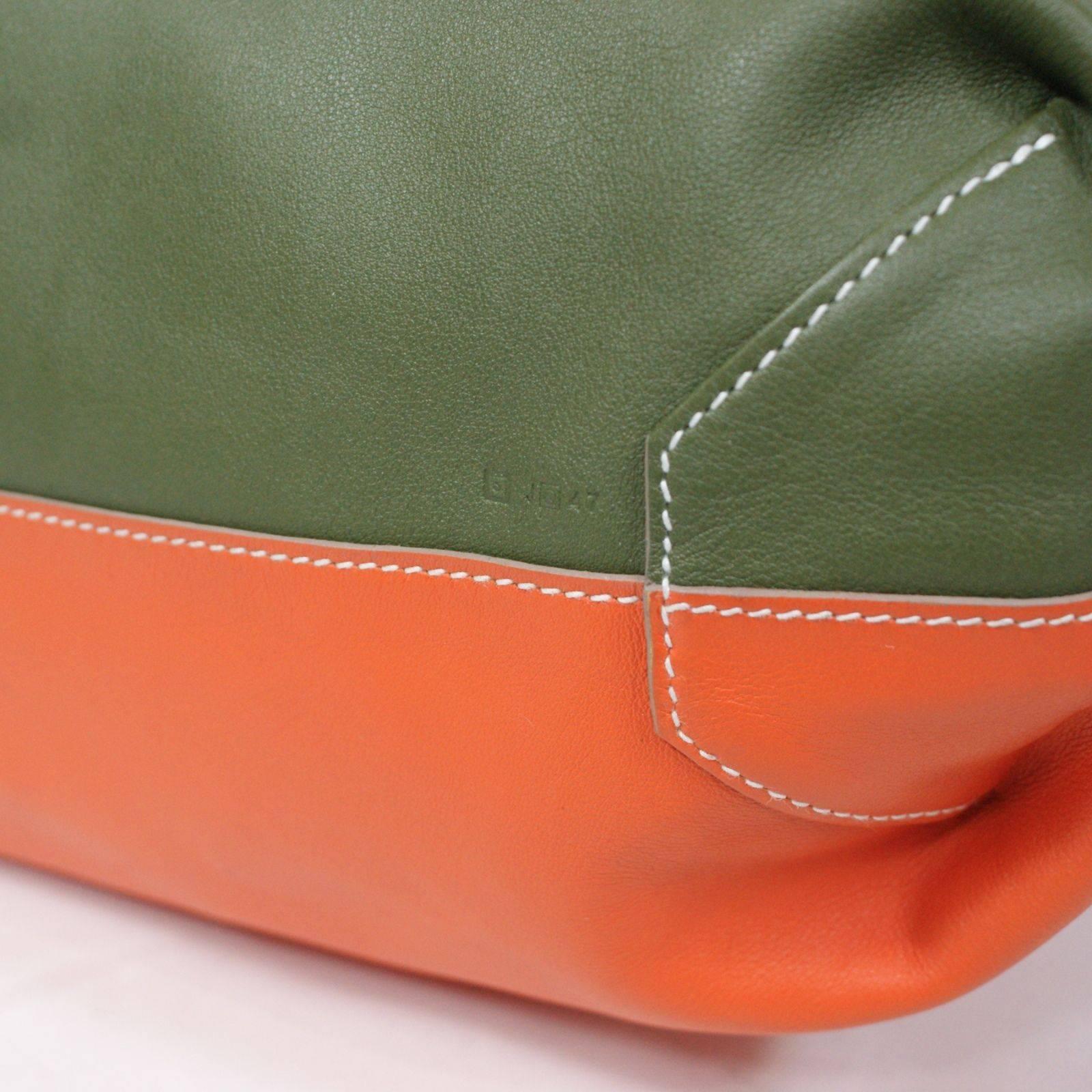 Color Block Leather Tote
Grey, Blue, Green and Orange
Reversible
Originally $3825.00
Excellent Condition