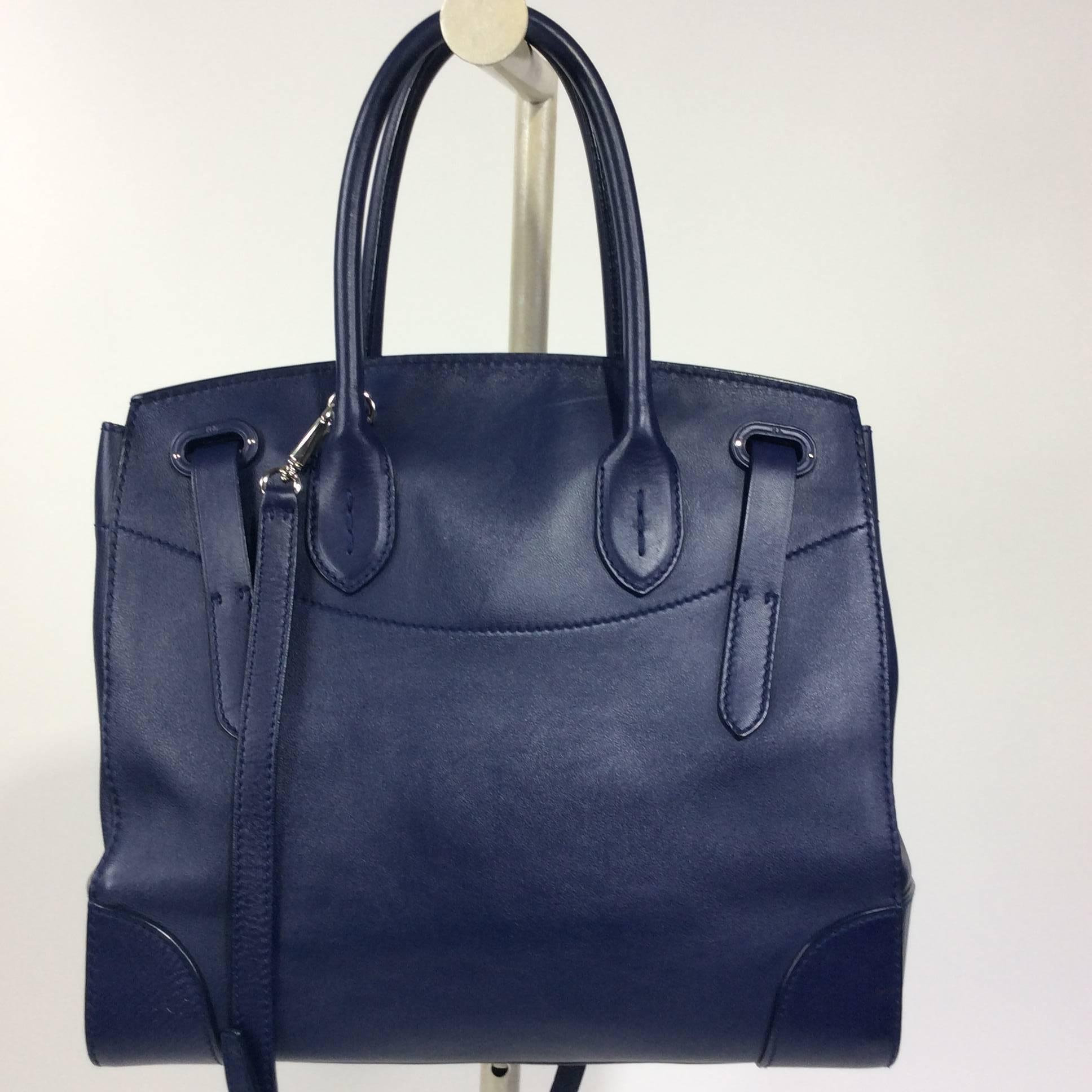 Ralph Lauren Navy Rickie bag with silver hardware and red interior lining. The bag has a removable shoulder strap which adds a 21