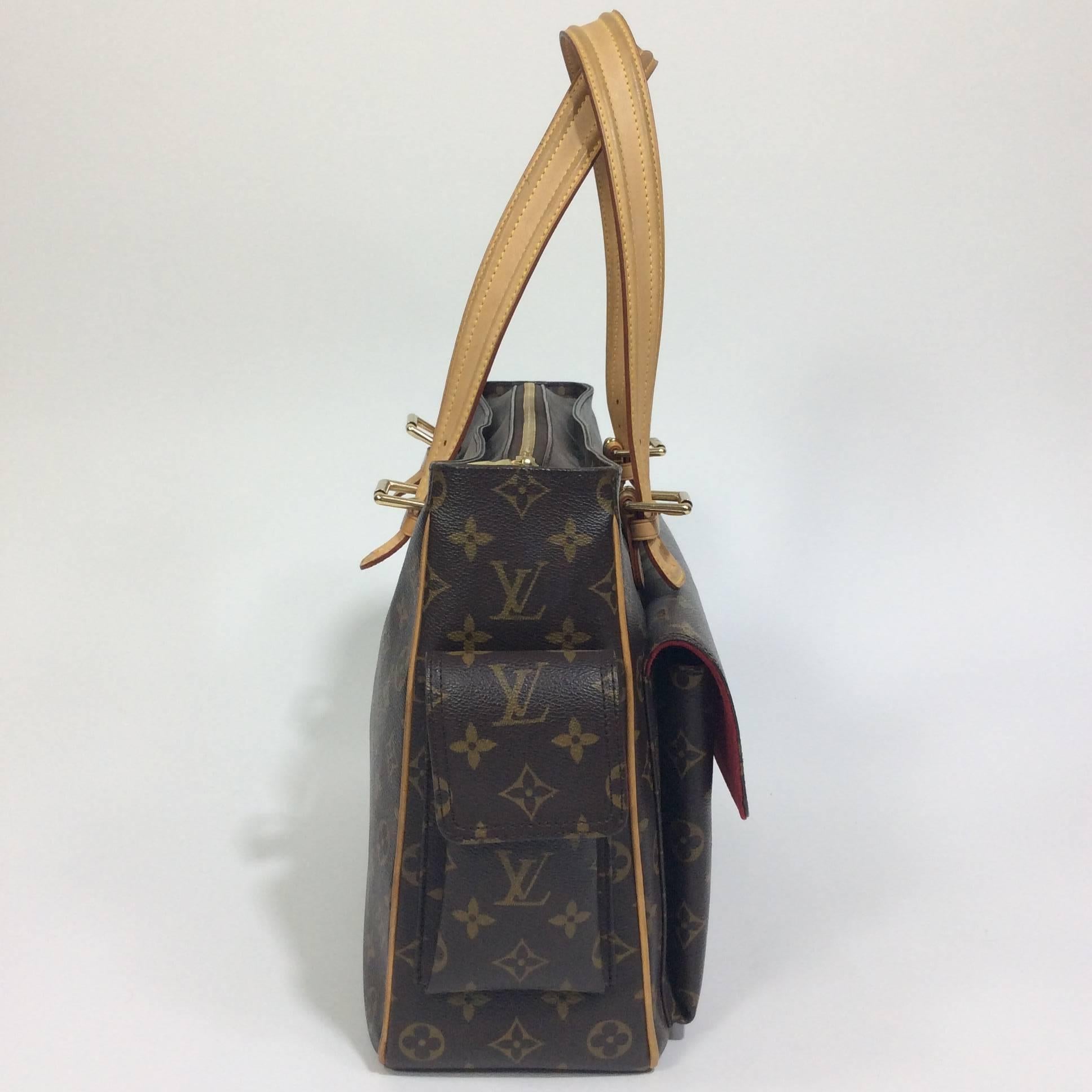 Louis Vuitton Shoulder Tote with Classic LV Monogram with light patina on straps and minimal wear on the interior as shown in images.