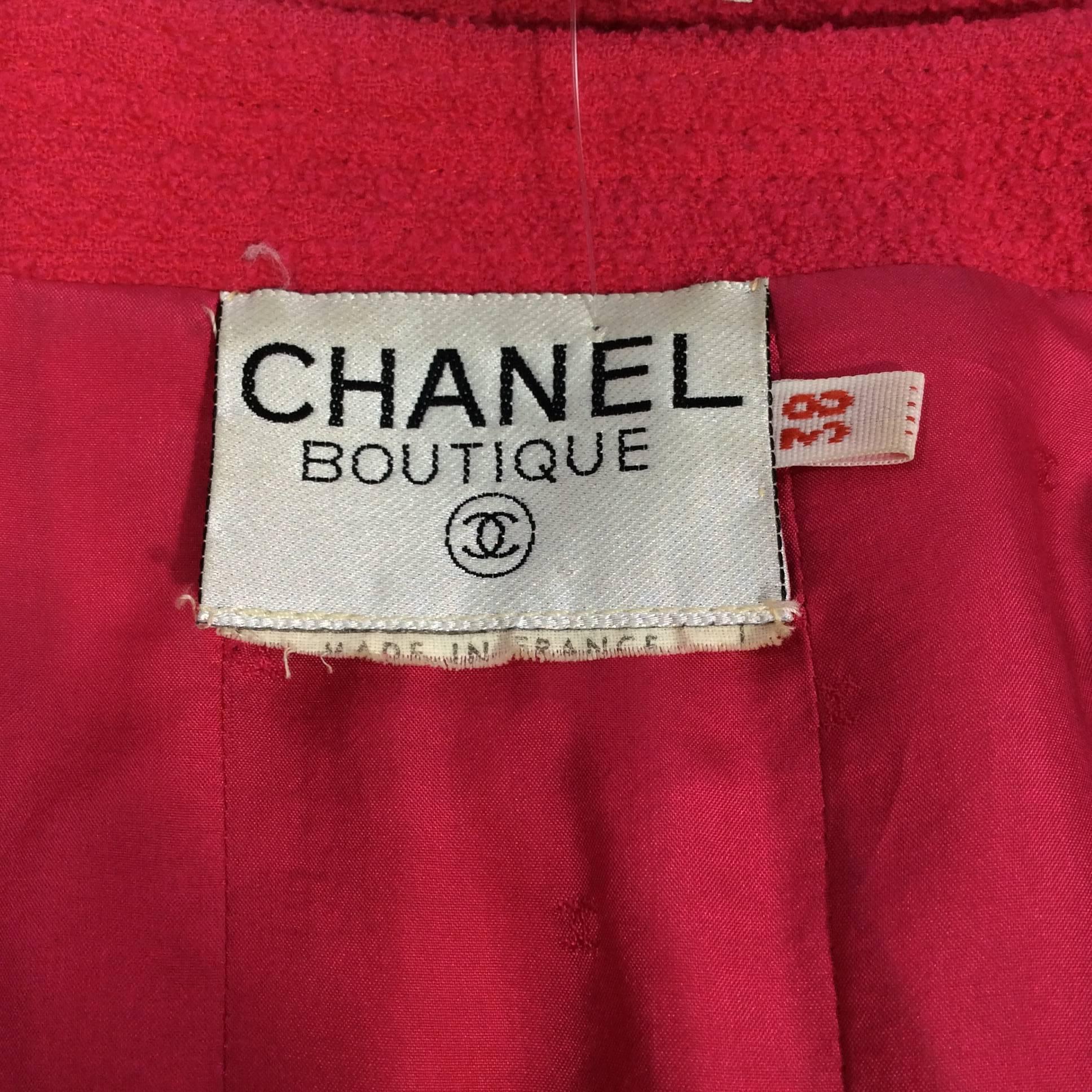 Chanel Fuscia Vintage Boucle Blazer with Gold Button Detail and slight issue with fabric as shown in images for the item. The blazer runs small and the size 38 fits a 2/4.