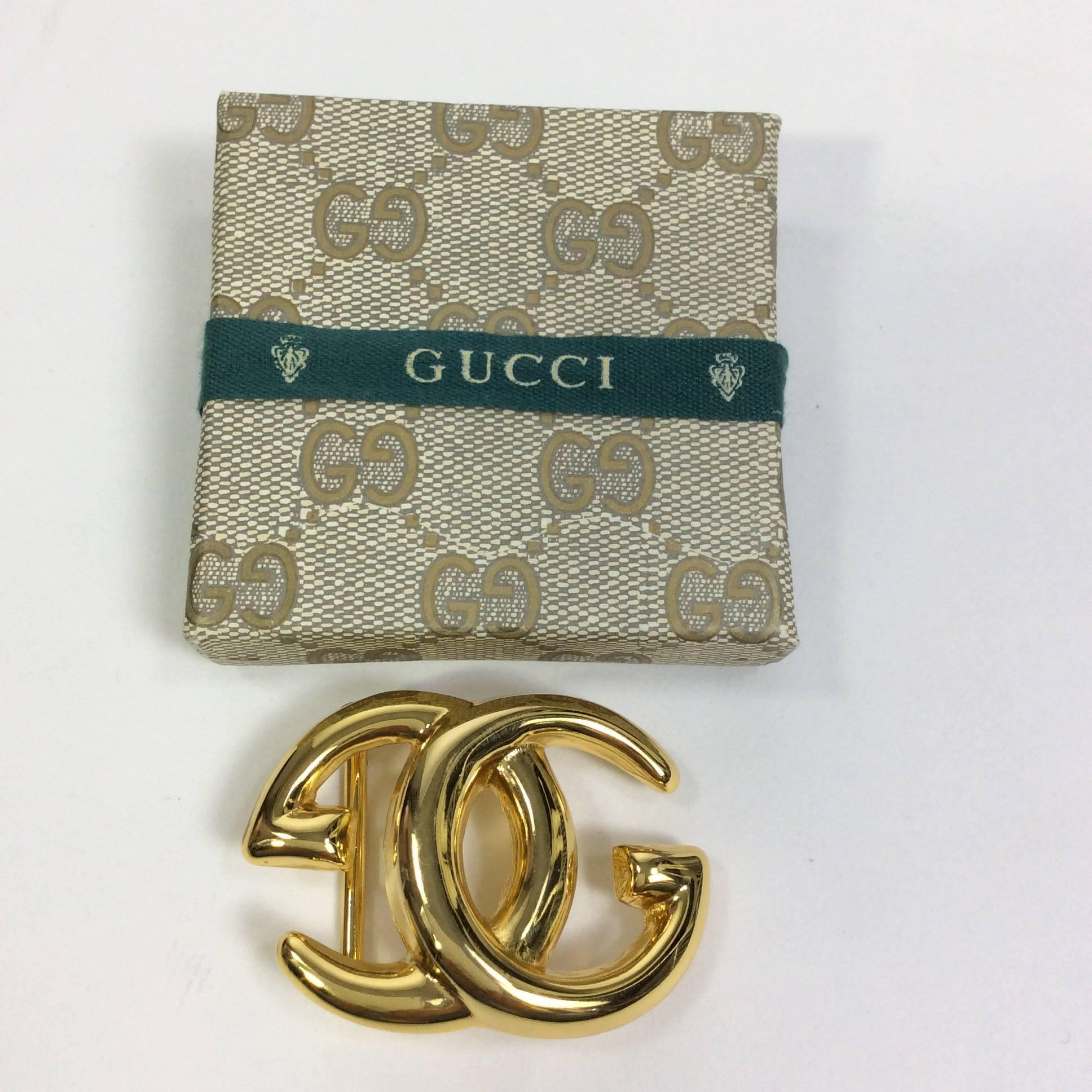 Gucci Goldtone Interlocking GG Belt Buckle with no visible tarnishing on hardware. The belt buckle inlcudes the original Gucci box and packaging. The buckle fits a 1.5 inch belt strap.