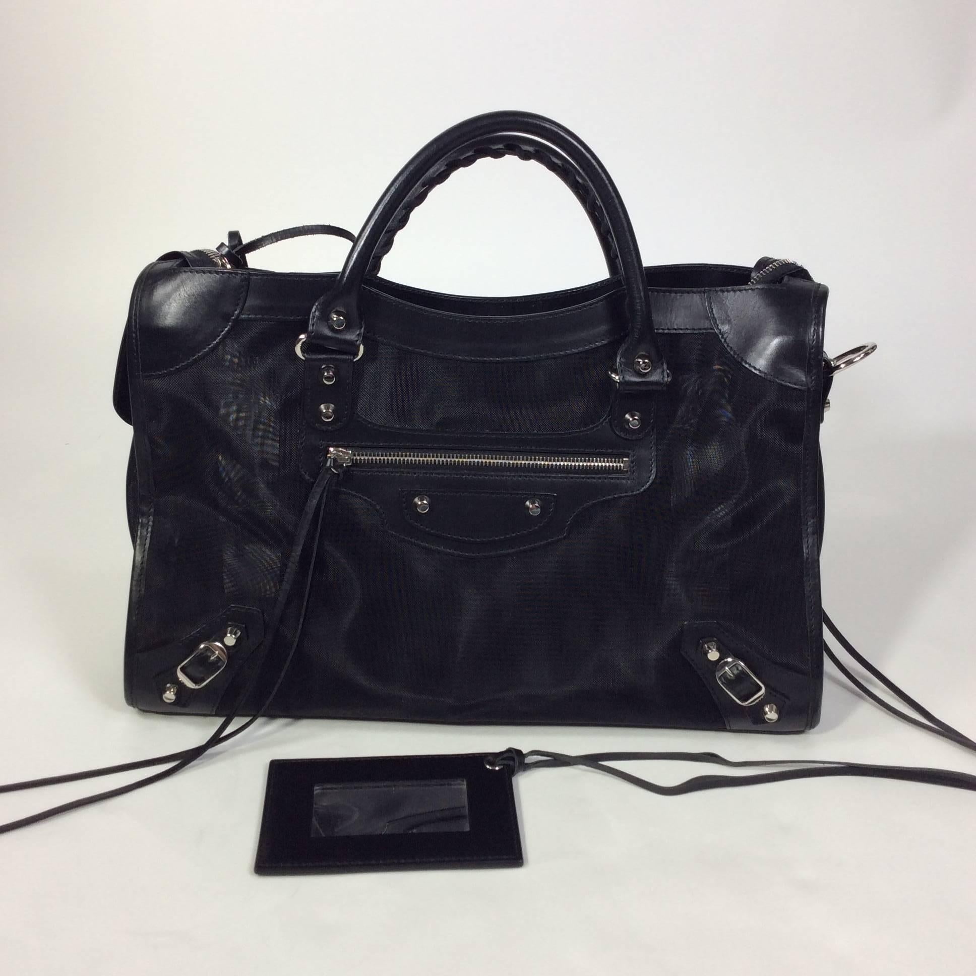 Balenciaga Black Mesh with Leather Trim and Silver Hardware City Bag. The bag is in excellent condition with no visible signs of wear on the bag. The handles are 5