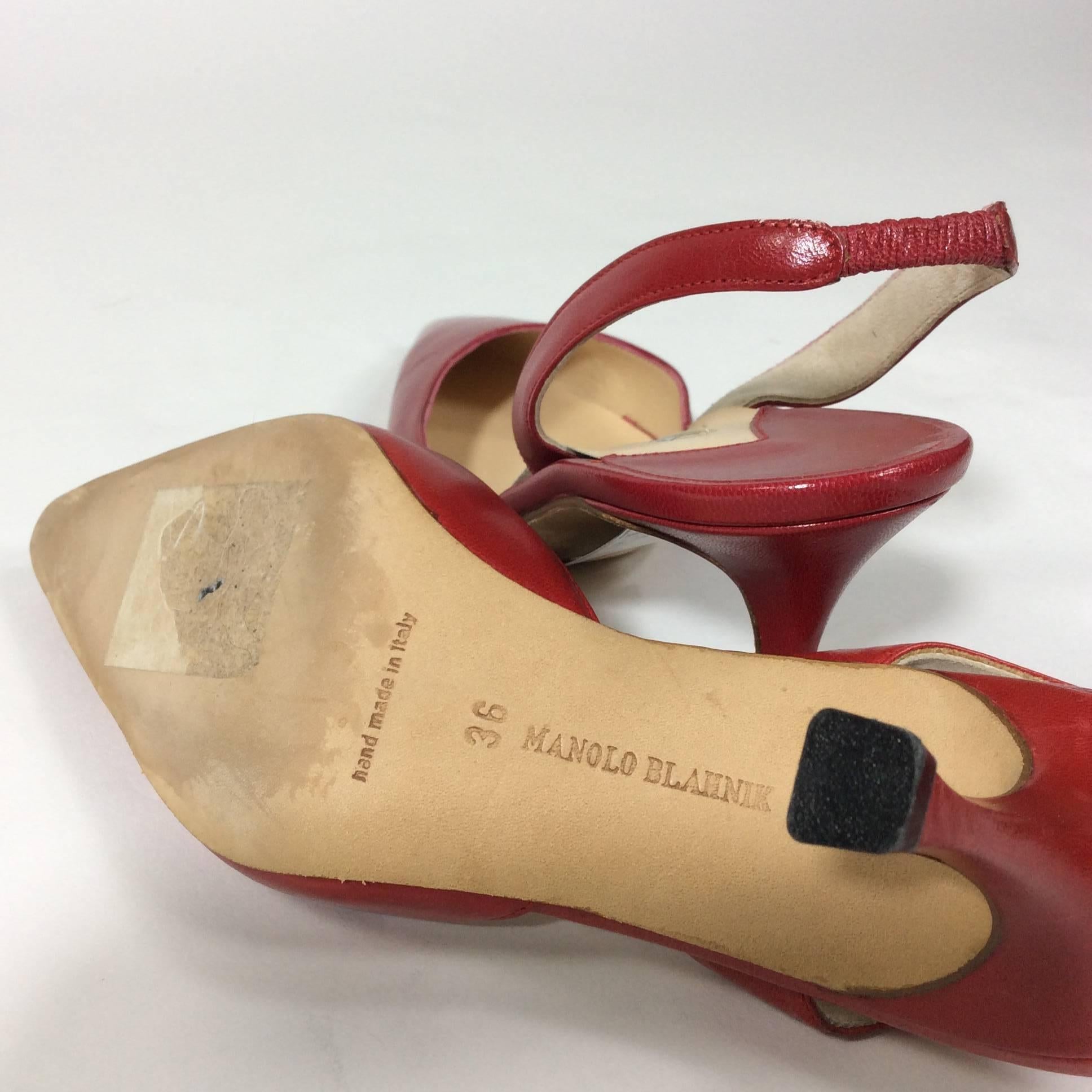 Manolo Blahnik Red Pointed Heels with Heel Strap with a 2 inch heel. Size is a 36 which equates to a 6 as the size runs small. Shoe is in great condition with minimal wear on the sole.