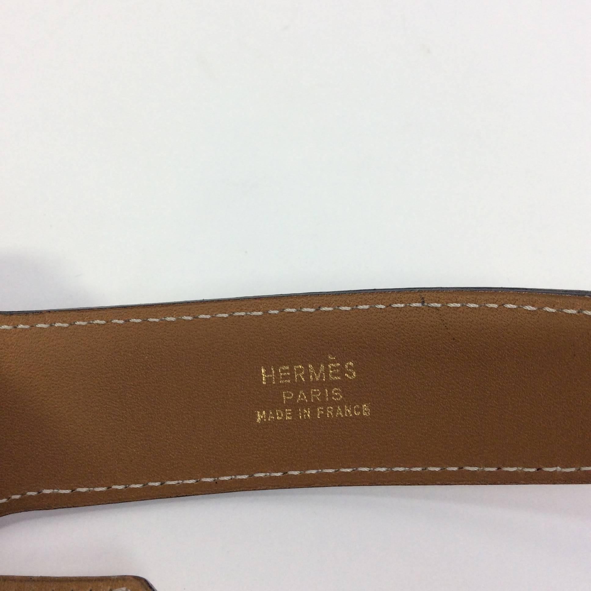 Tan Leather Kelly Belt
35 inches long, adjustable to 33 inches
1.5 inches wide
Includes gold hardware with engraved Hermes logo
Tan leather with white topstiching and black accents