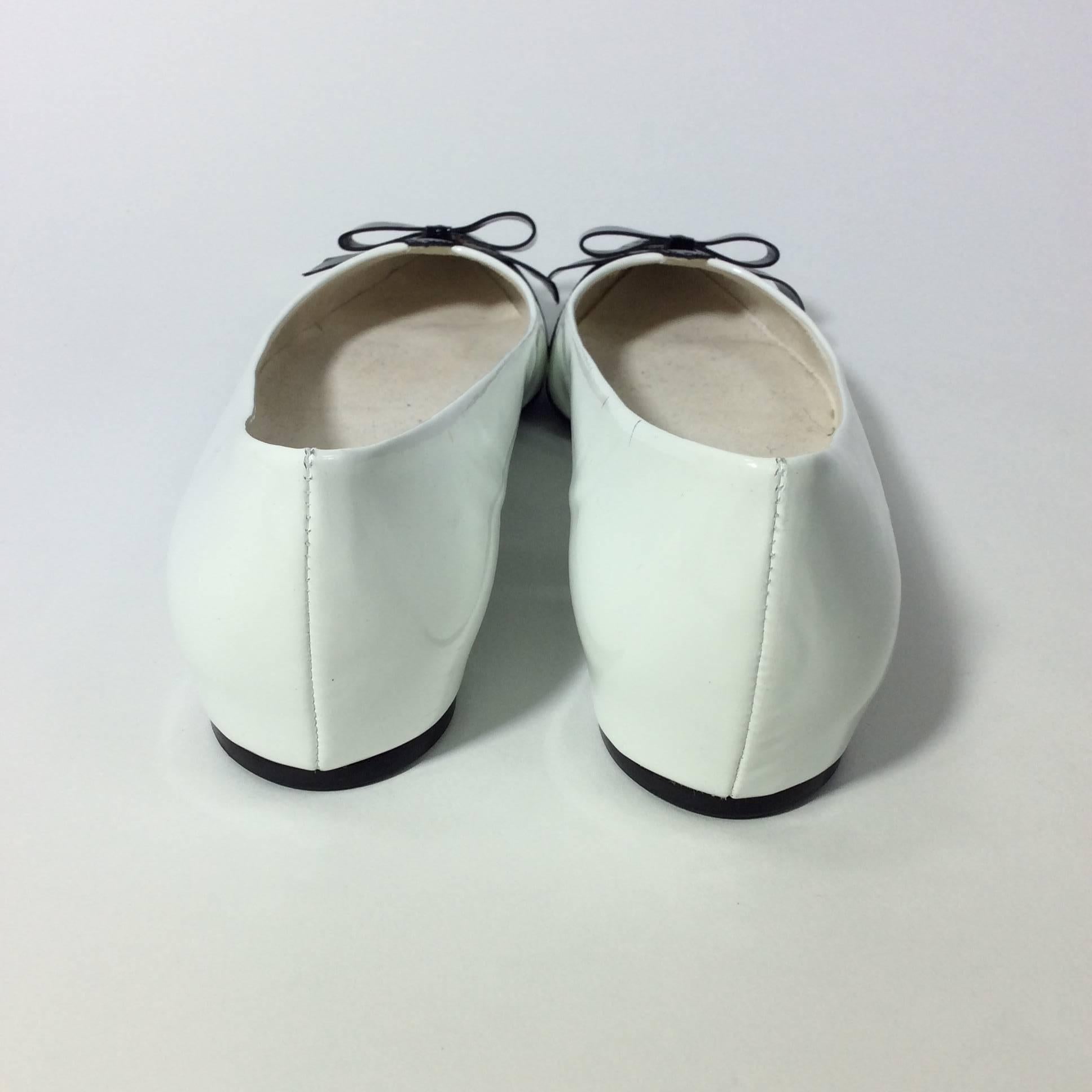 Women's Stuart Weitzman White Patent Flats with Black Toes