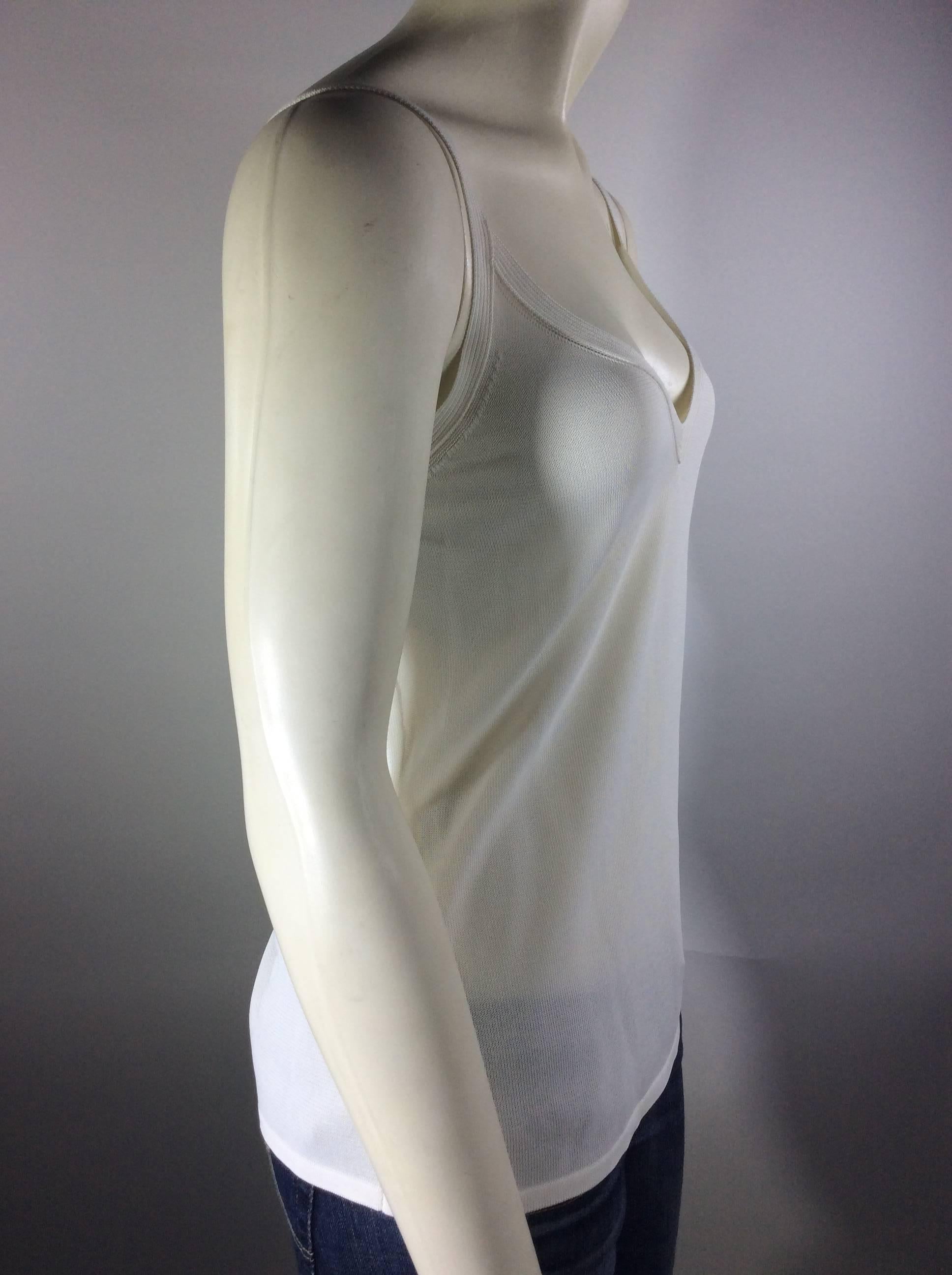 White v-neck 
Thin straps 
Woven rayon 