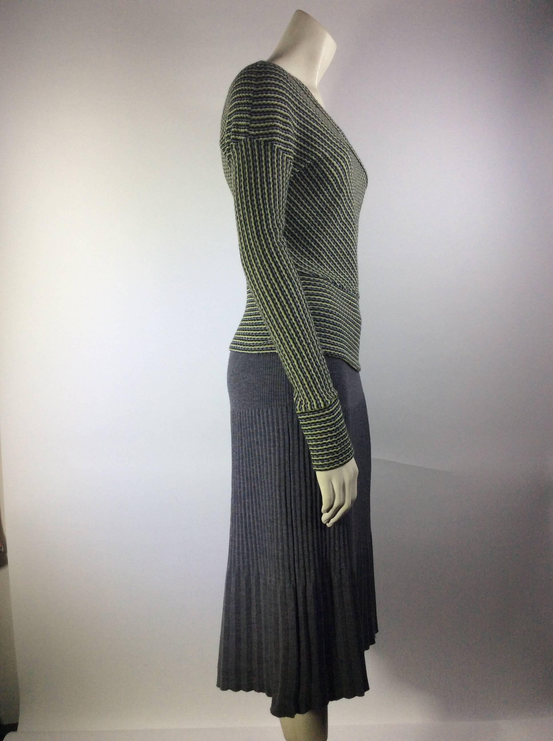 Long sleeve 
Grey white and lime green strips
Suplise neck line 
Grey A-line Skirt
