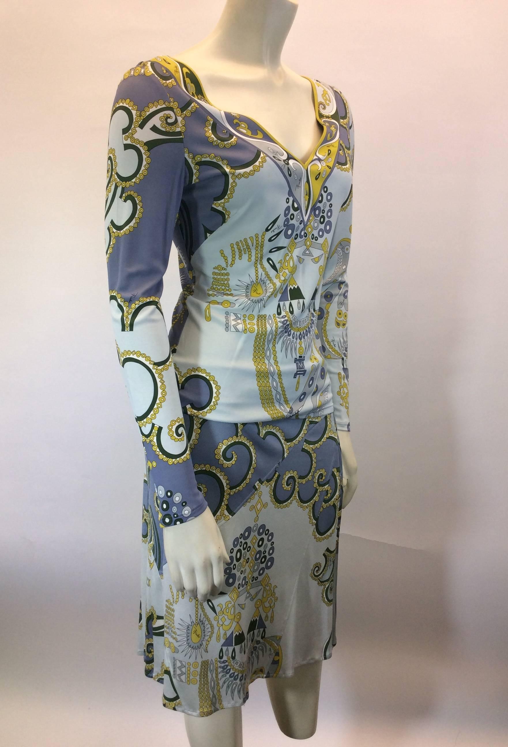 Emilio Pucci Blouse and Skirt Set
Yellow, Green Accents on shades of Blue Graphics 
Easily Slip on Blouse
Hidden Side Zipper on Skirt