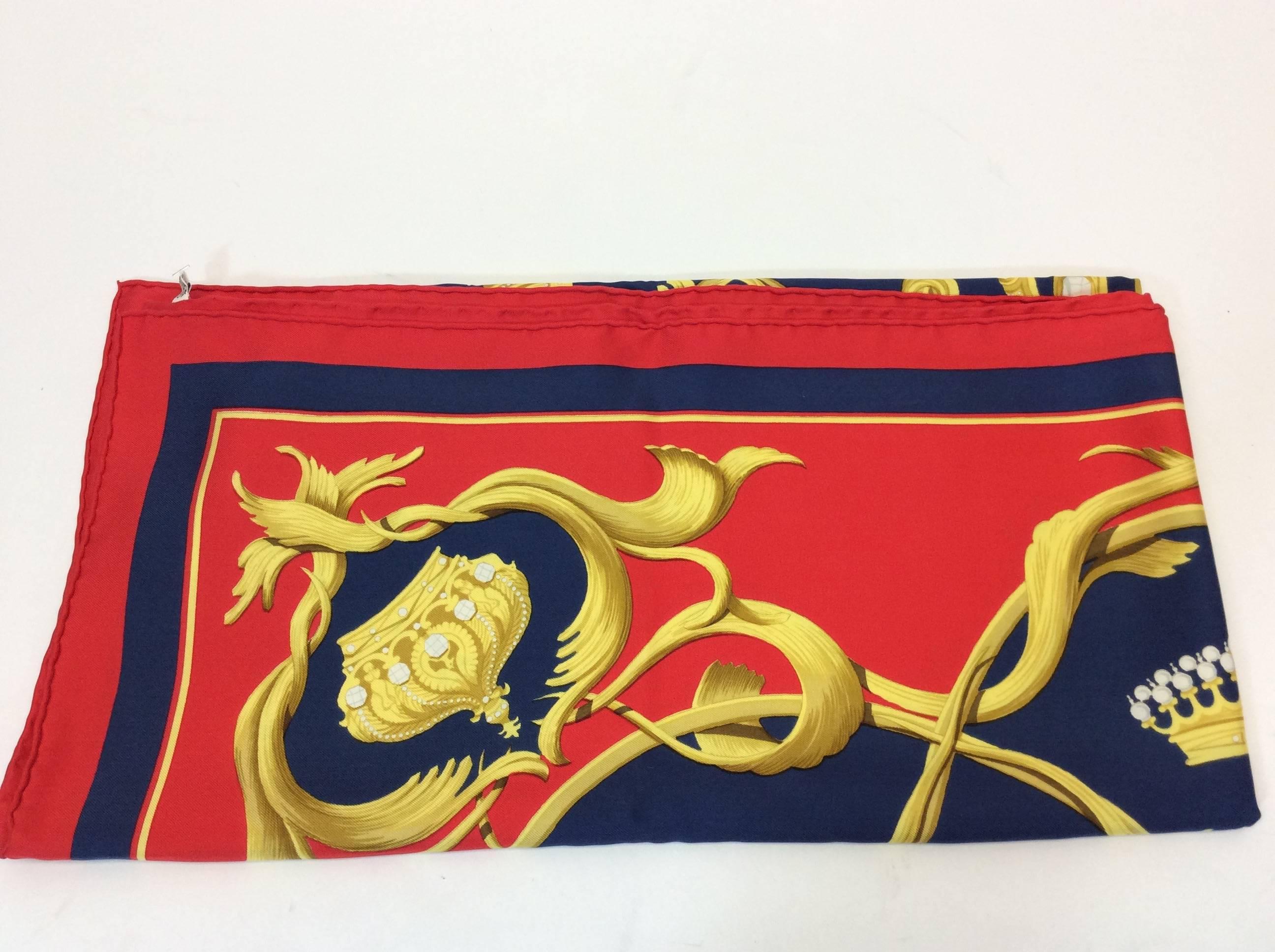 Authentic Hermes 100% silk scarf by Julia Abadie
First issued in 1969
The scarf features crowns or couronnes. 
100% Silk, Copyright symbol is on the scarf. 
34 1/2