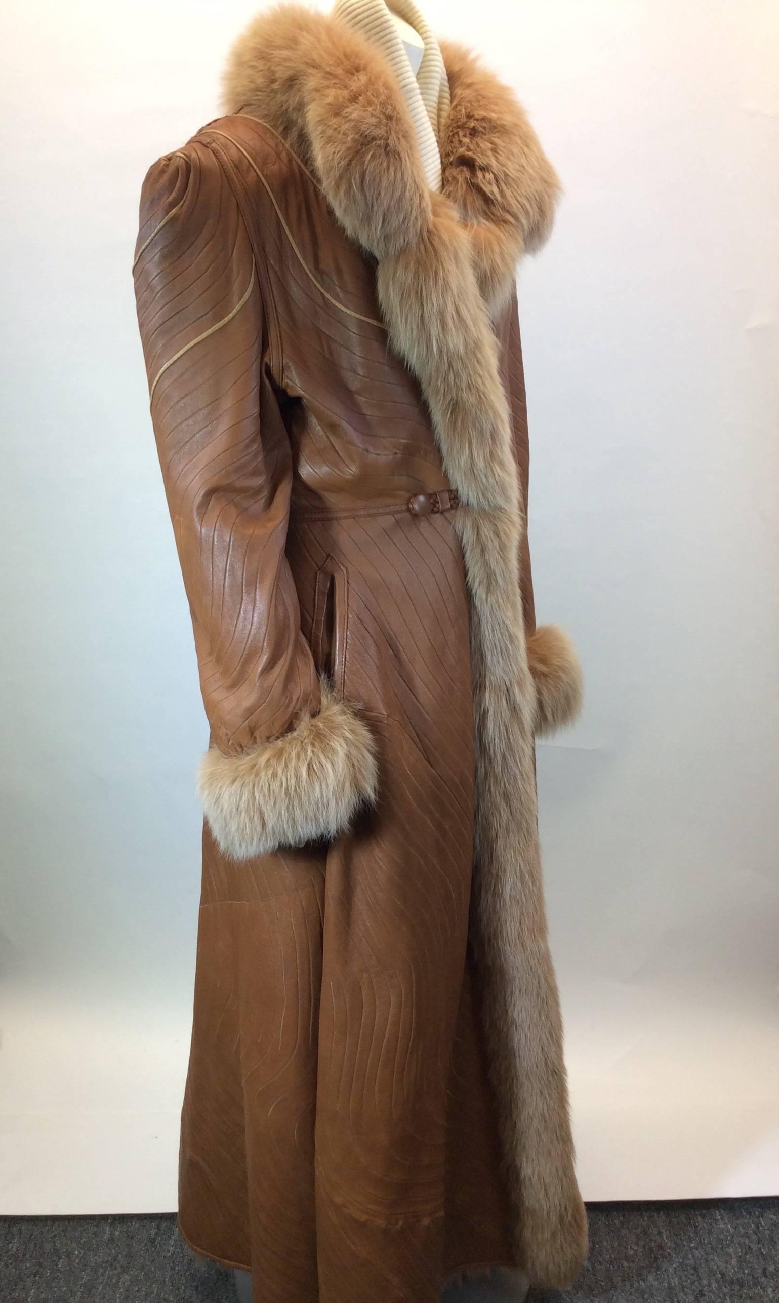 Reversible Coat
100% Genuine Fox Fur on Interior
Multicolored Swirl Fur 
Fox Fur lining on cuffs and collar
27" Inch Sleeve
Leather Rope Tie for Closure
