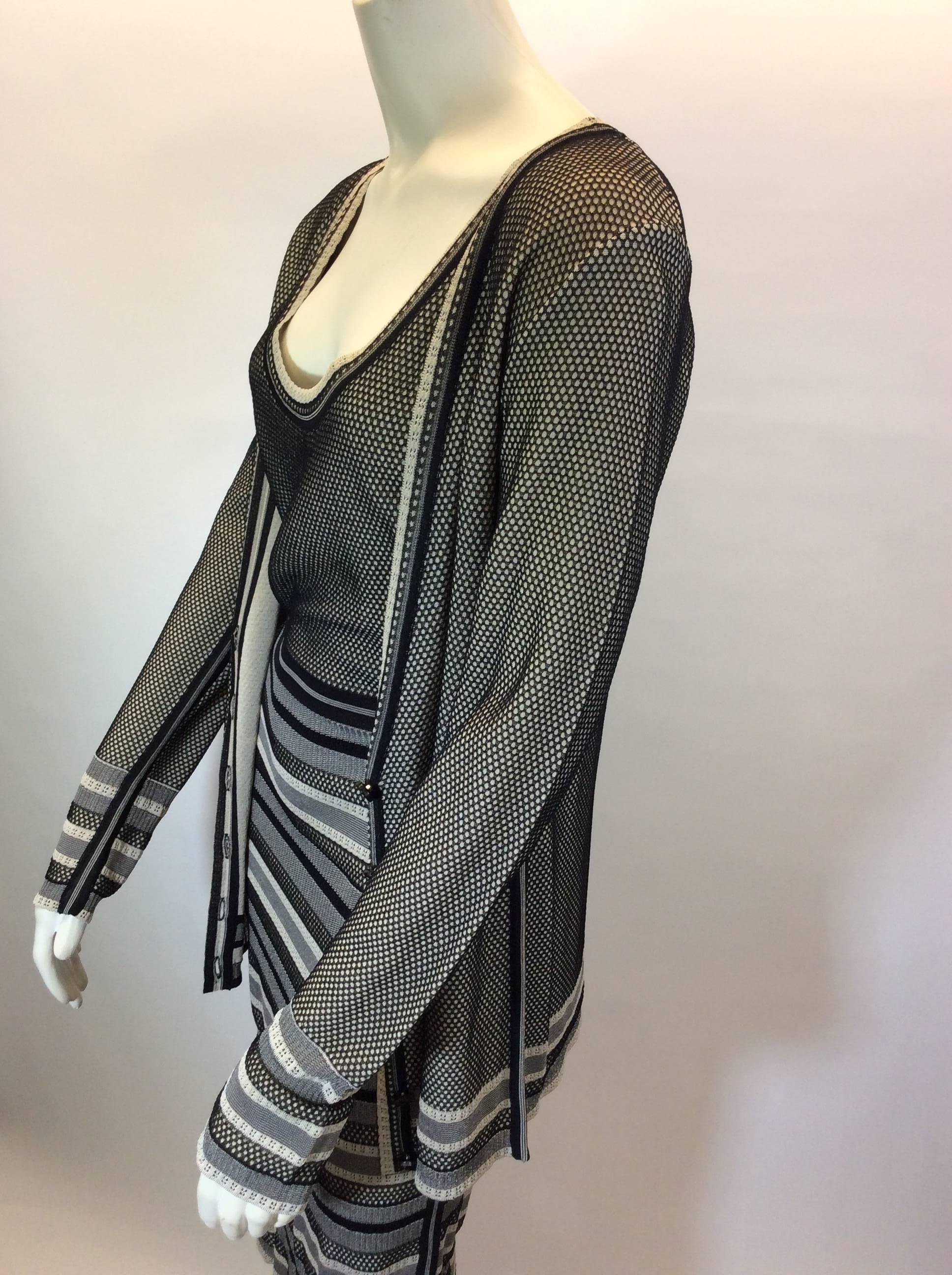 Striped Knit Dress and Cardigan Set
Black and tan striped knit design
Cardigan features center front button closures
Sleeveless knit dress
Size Medium
76% Viscose, 24% Polyamide