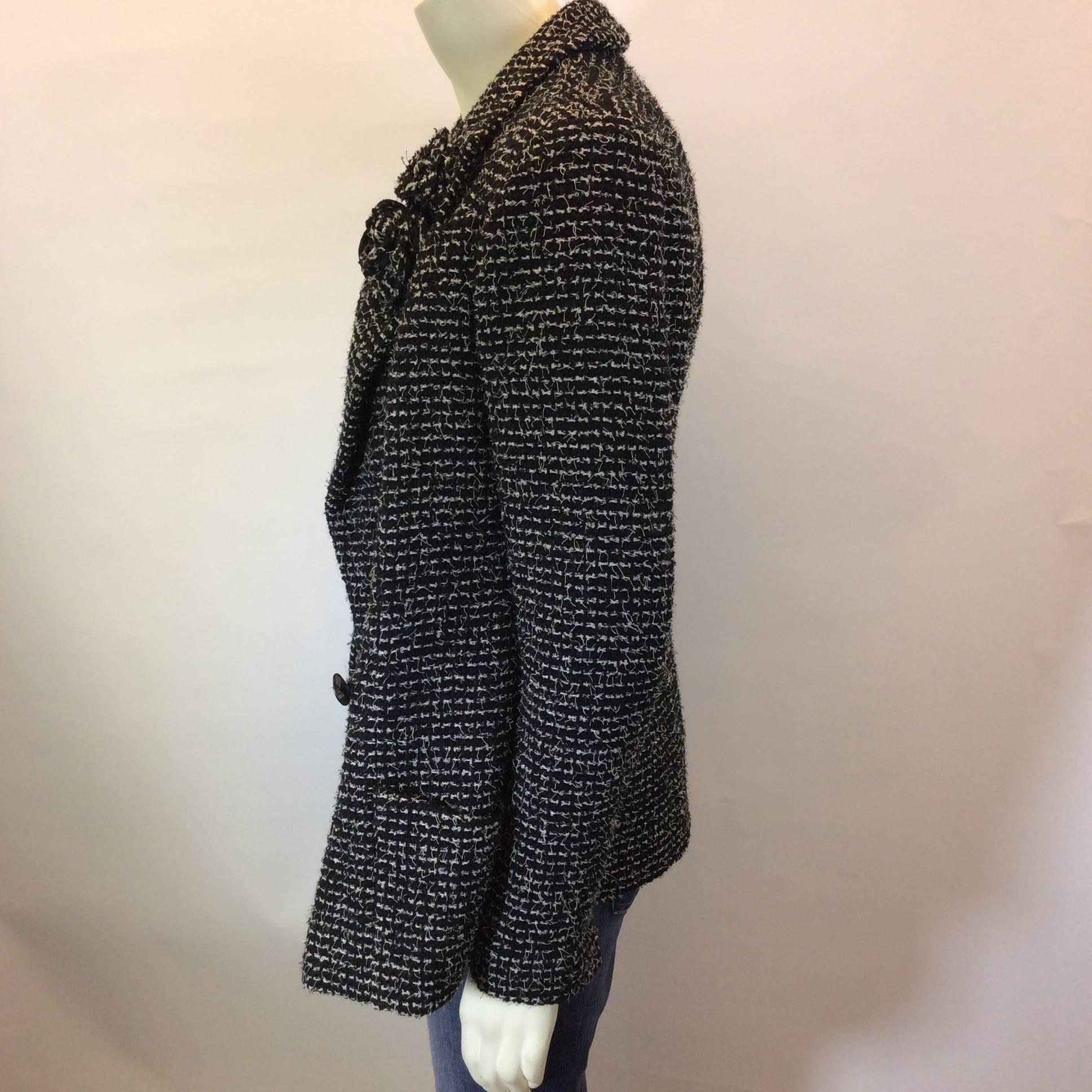 Chanel Black and White Sequined Tweed Jacket with Florettes In Excellent Condition For Sale In Narberth, PA